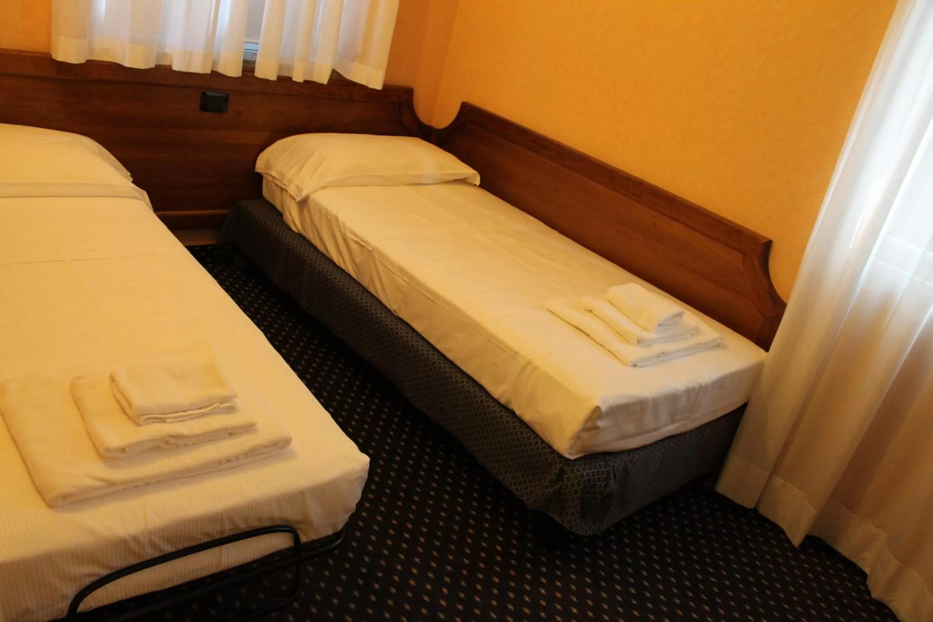 Bed in Hotel Don Carlo