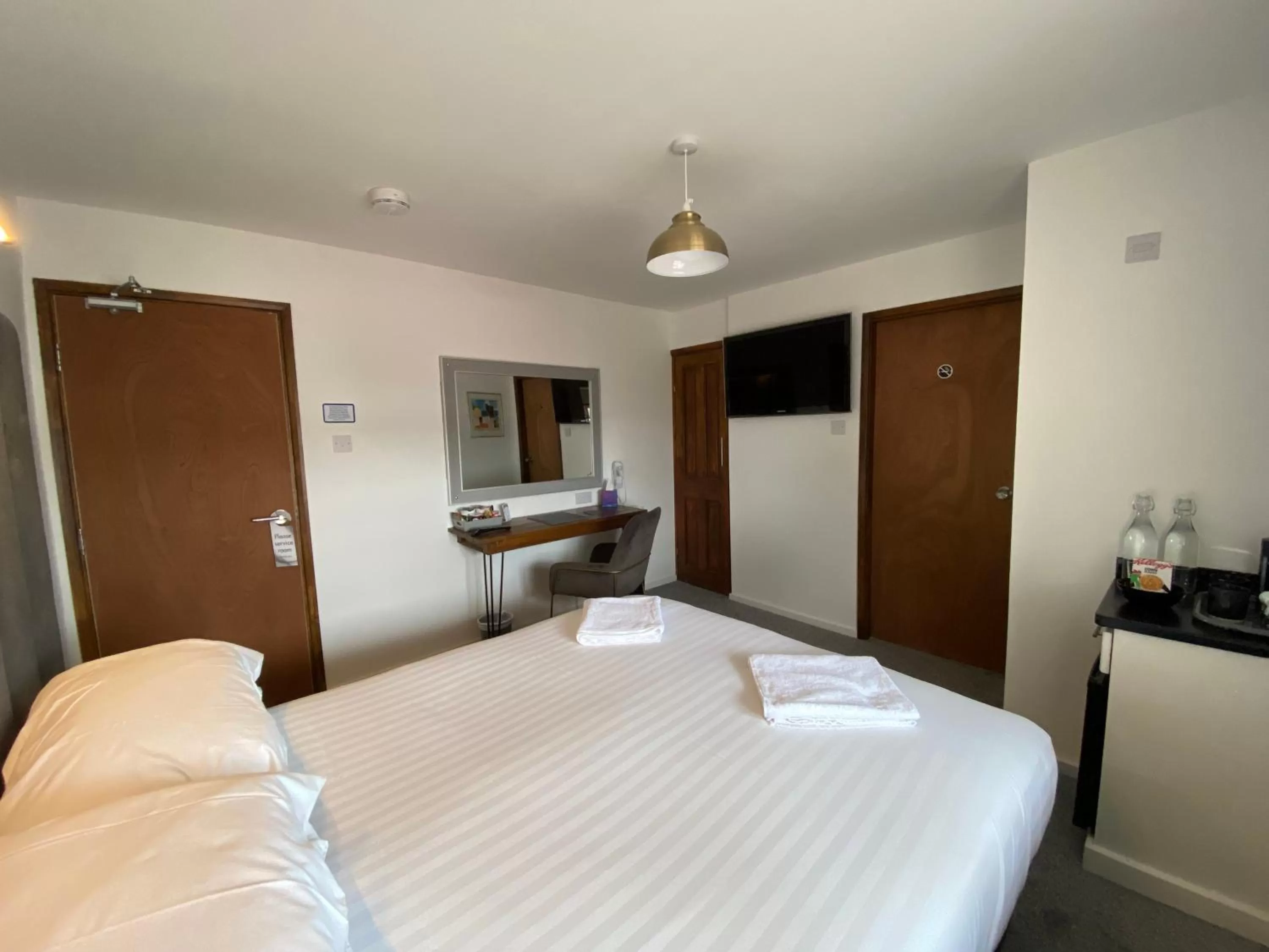 Bed in The Crossroads Inn