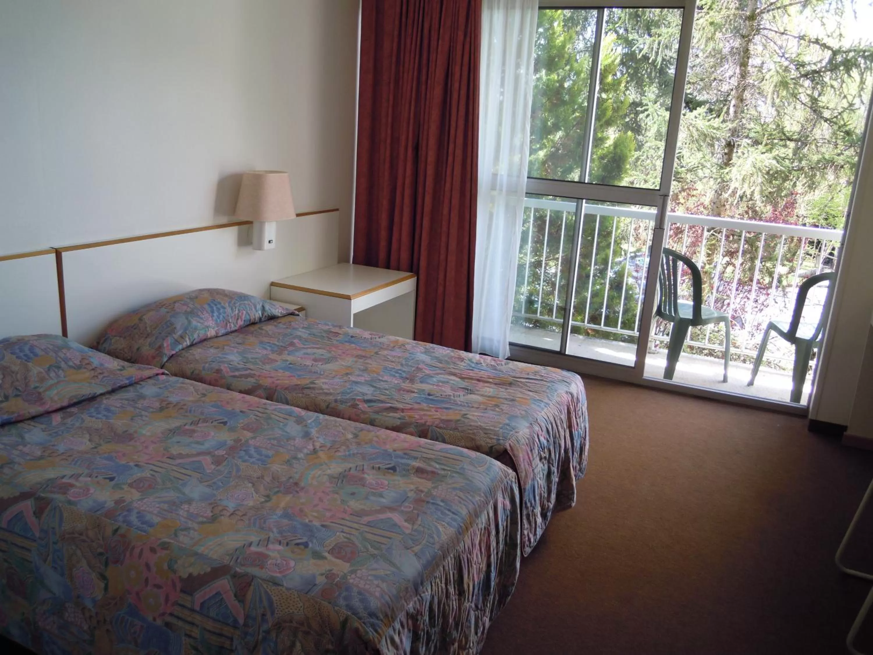 Photo of the whole room, Bed in Hôtel Restaurant Pavillon Carina