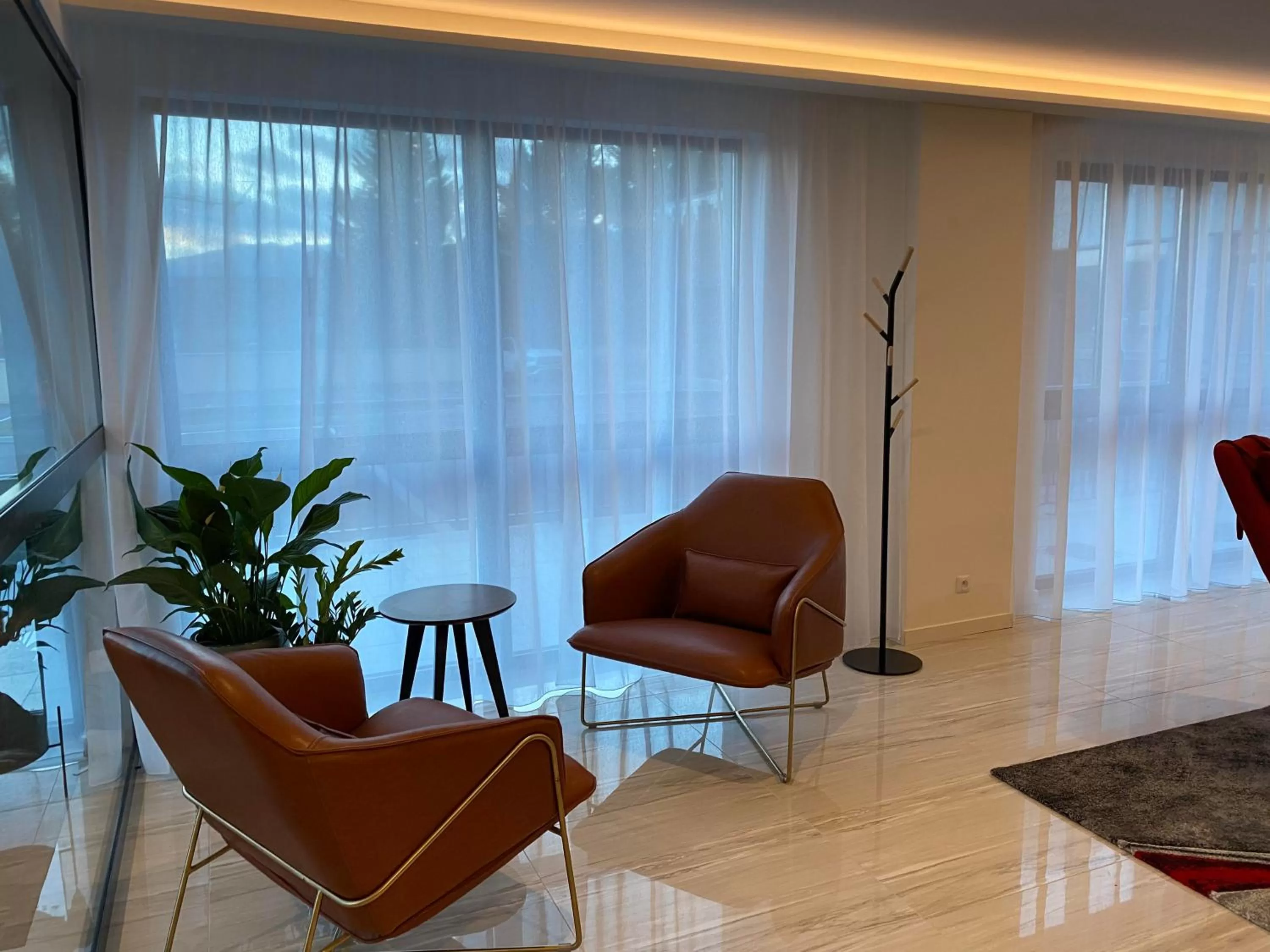 Communal lounge/ TV room in Woods Genève-Thoiry