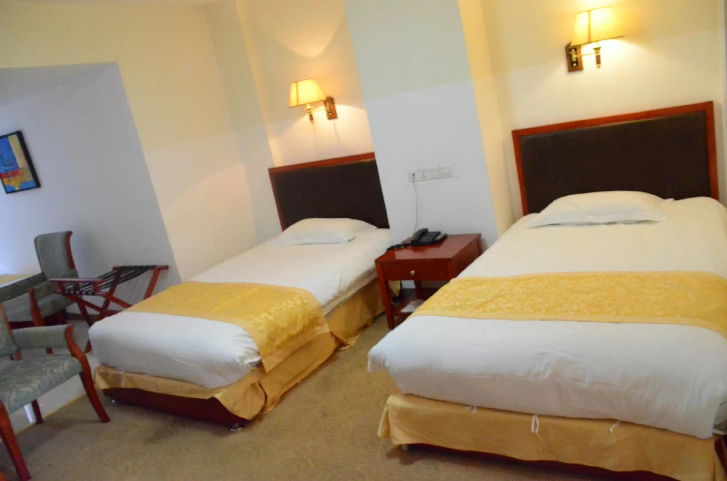 Bed in Soluxe Club International Hotel