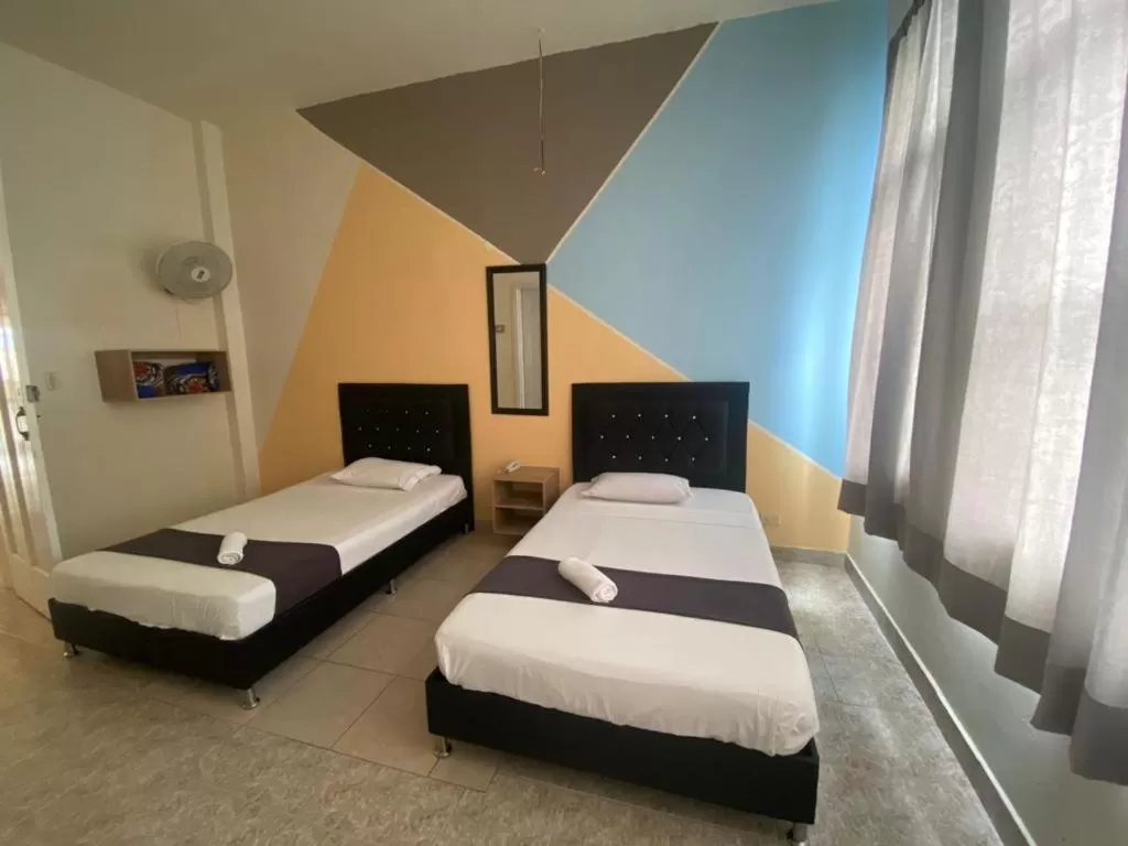 Bed in HOTEL CALLE REAL SUITE