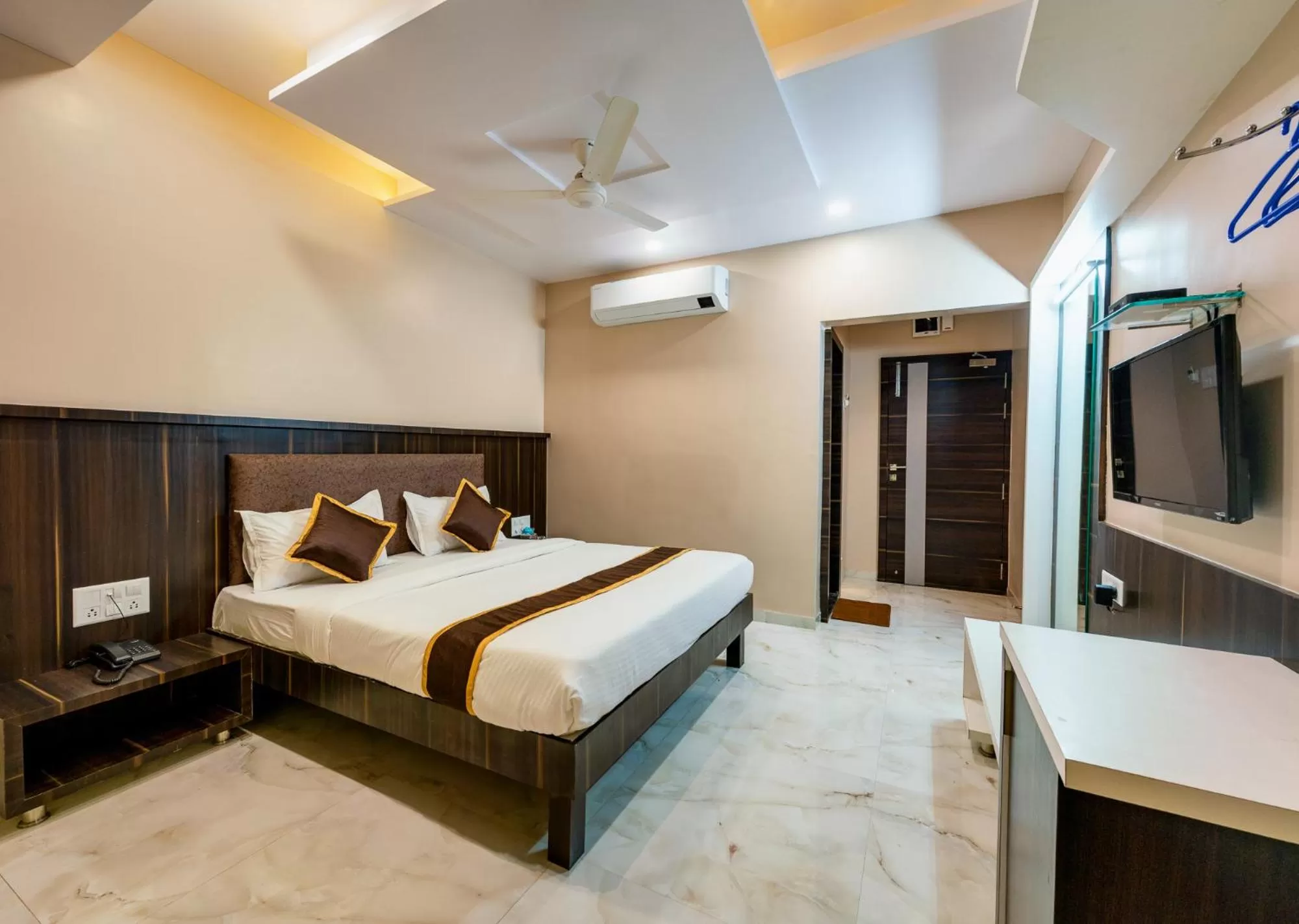 Photo of the whole room, Bed in Hotel Aatithya Satkar Near Mahalaxmi Temple