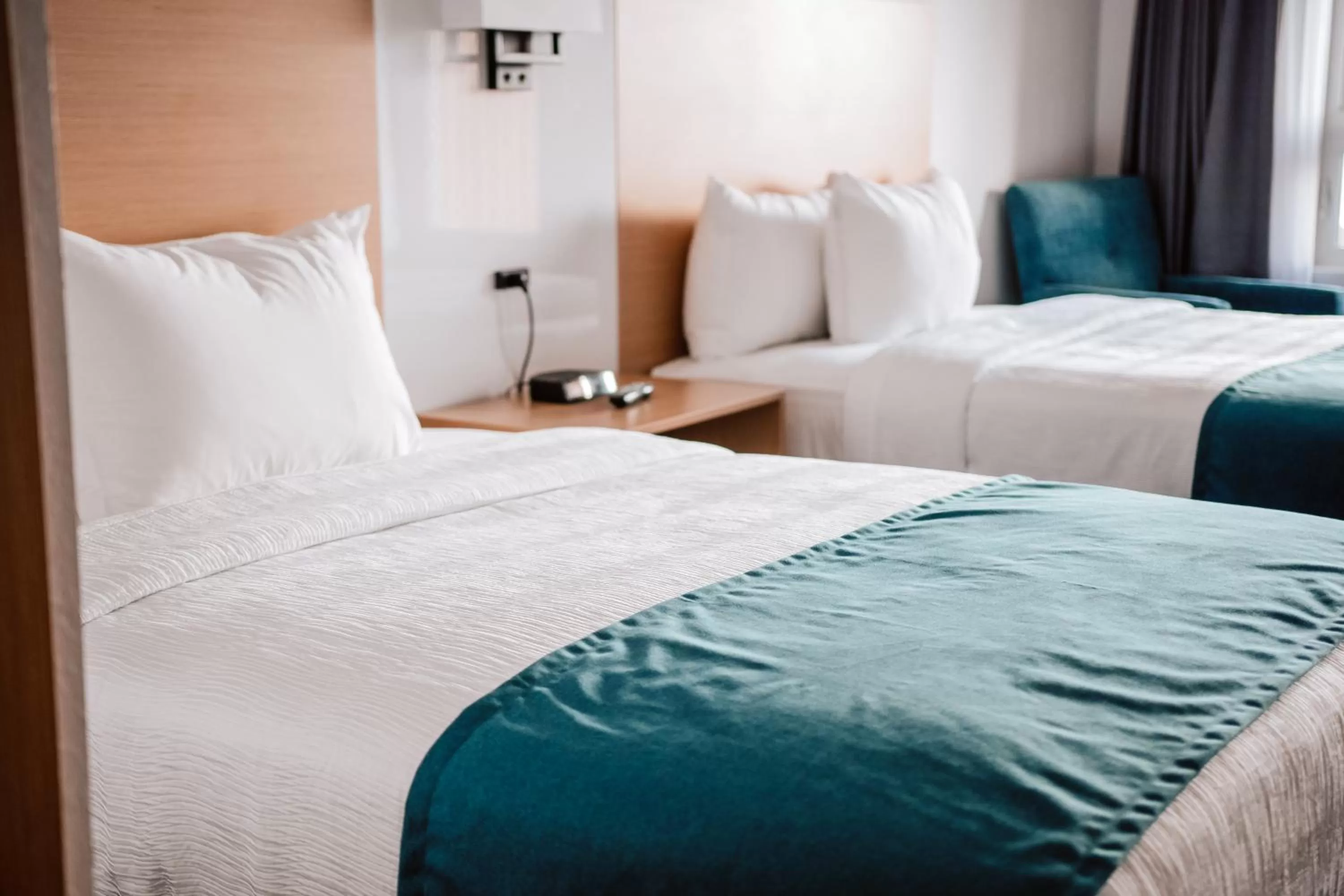 Bed in La Place Rendez-Vous Hotel