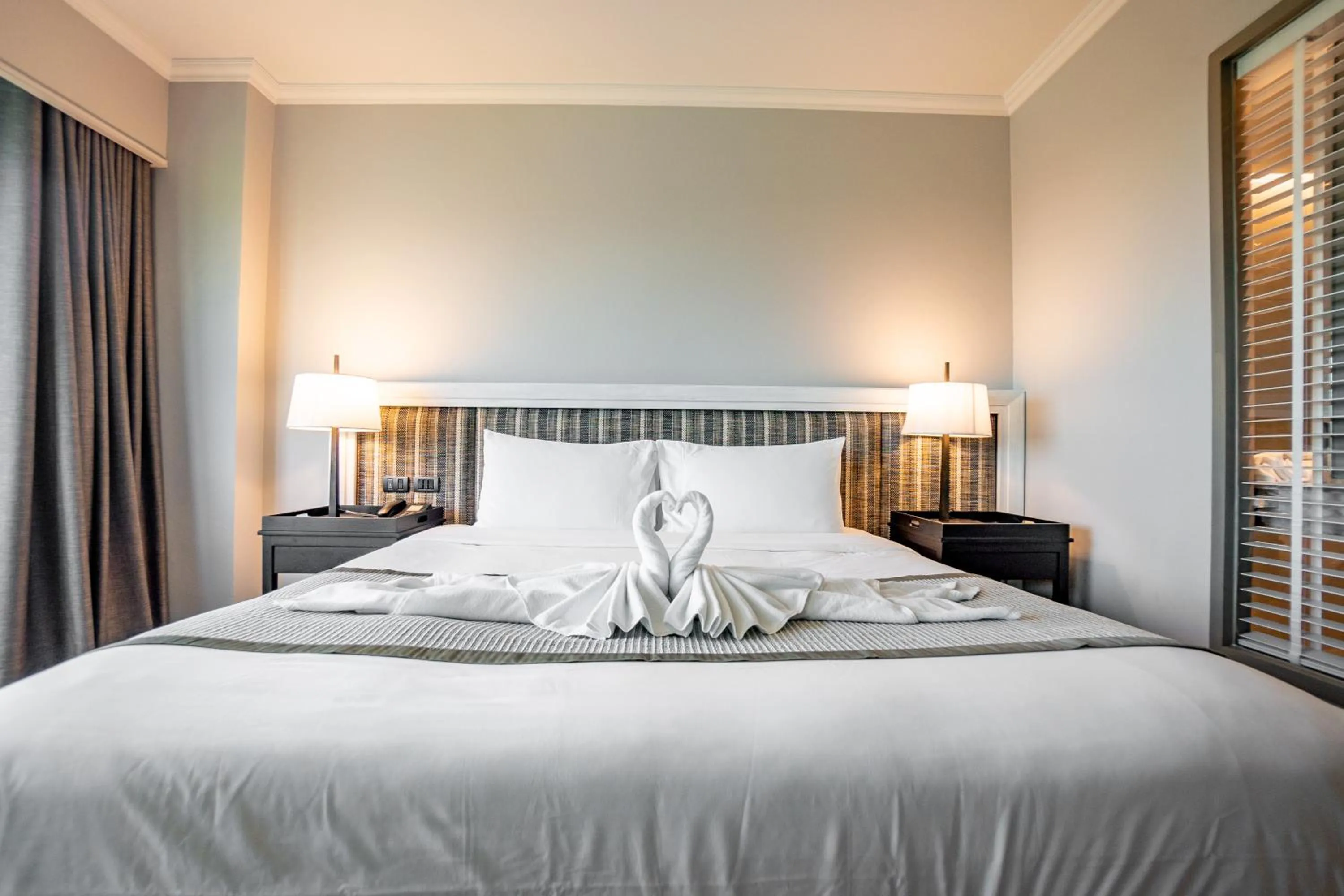 Bed in The Grand Riverside Hotel