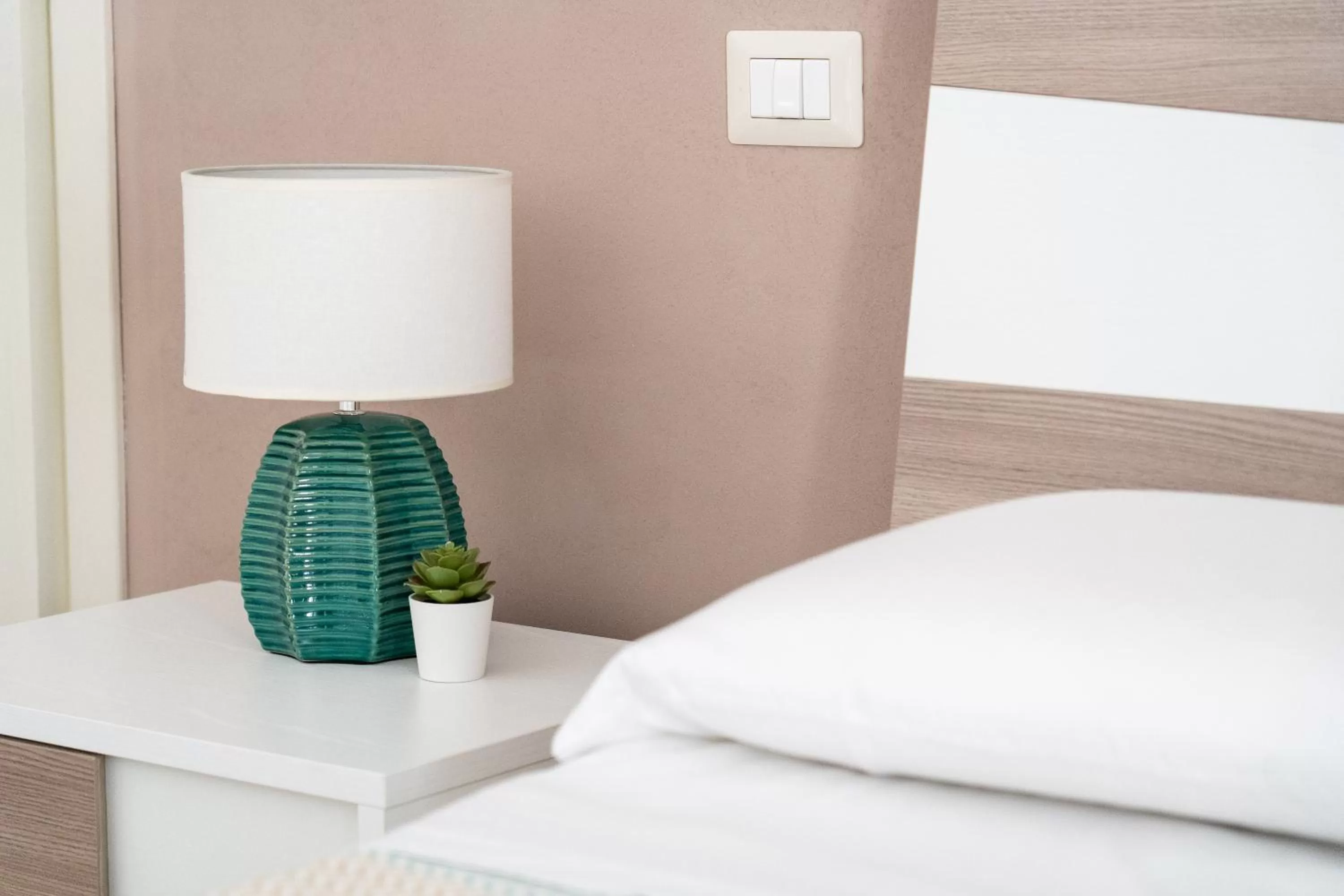 Bed in Portosalvo Rooms