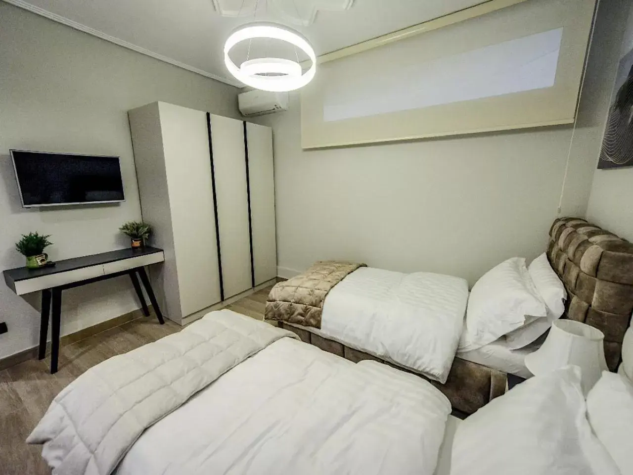 Economy Triple Room in Hotel Vila Tirana Economy Triple Room in Hotel Vila Tirana