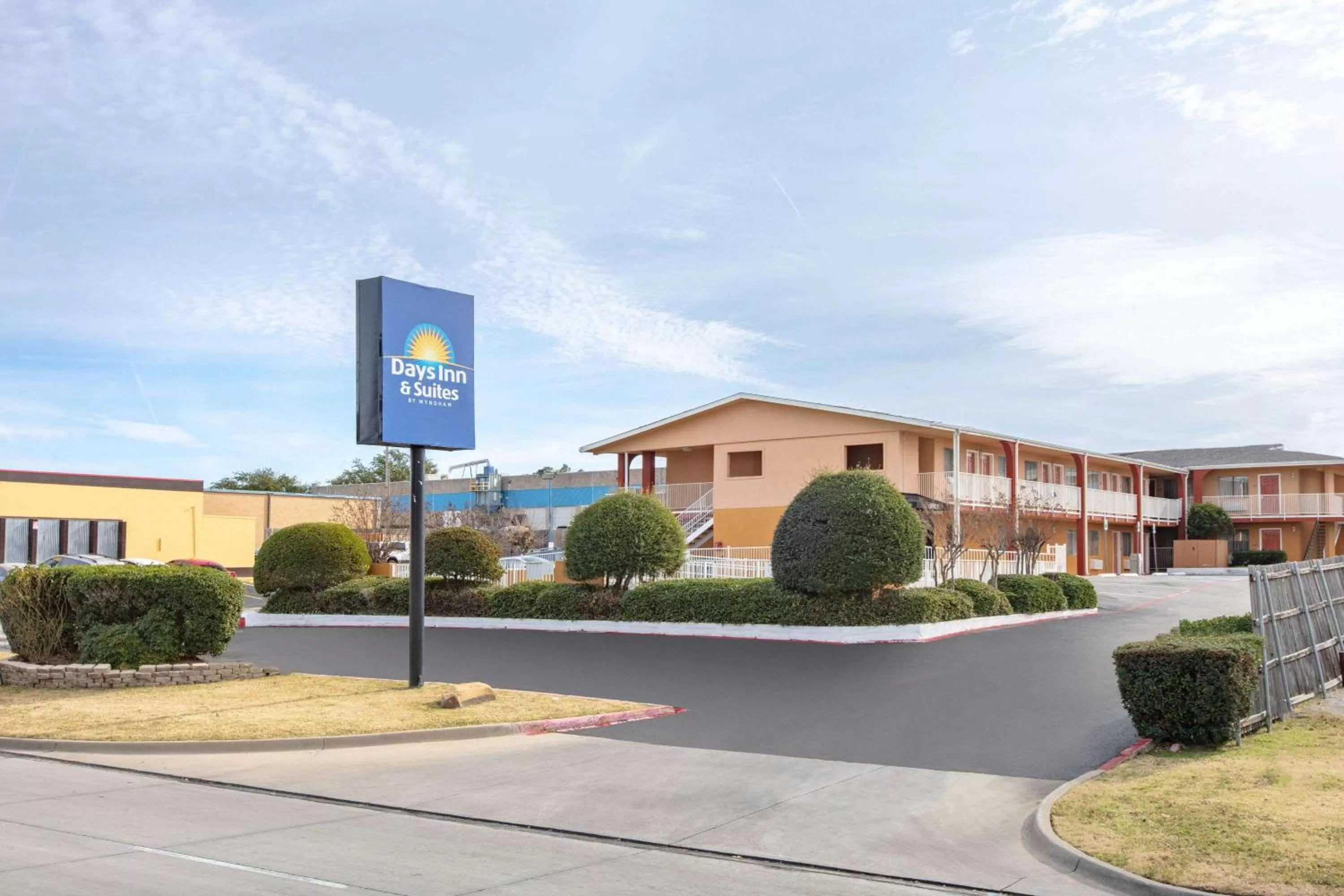 Property building in Days Inn & Suites by Wyndham Arlington Near Six Flags
