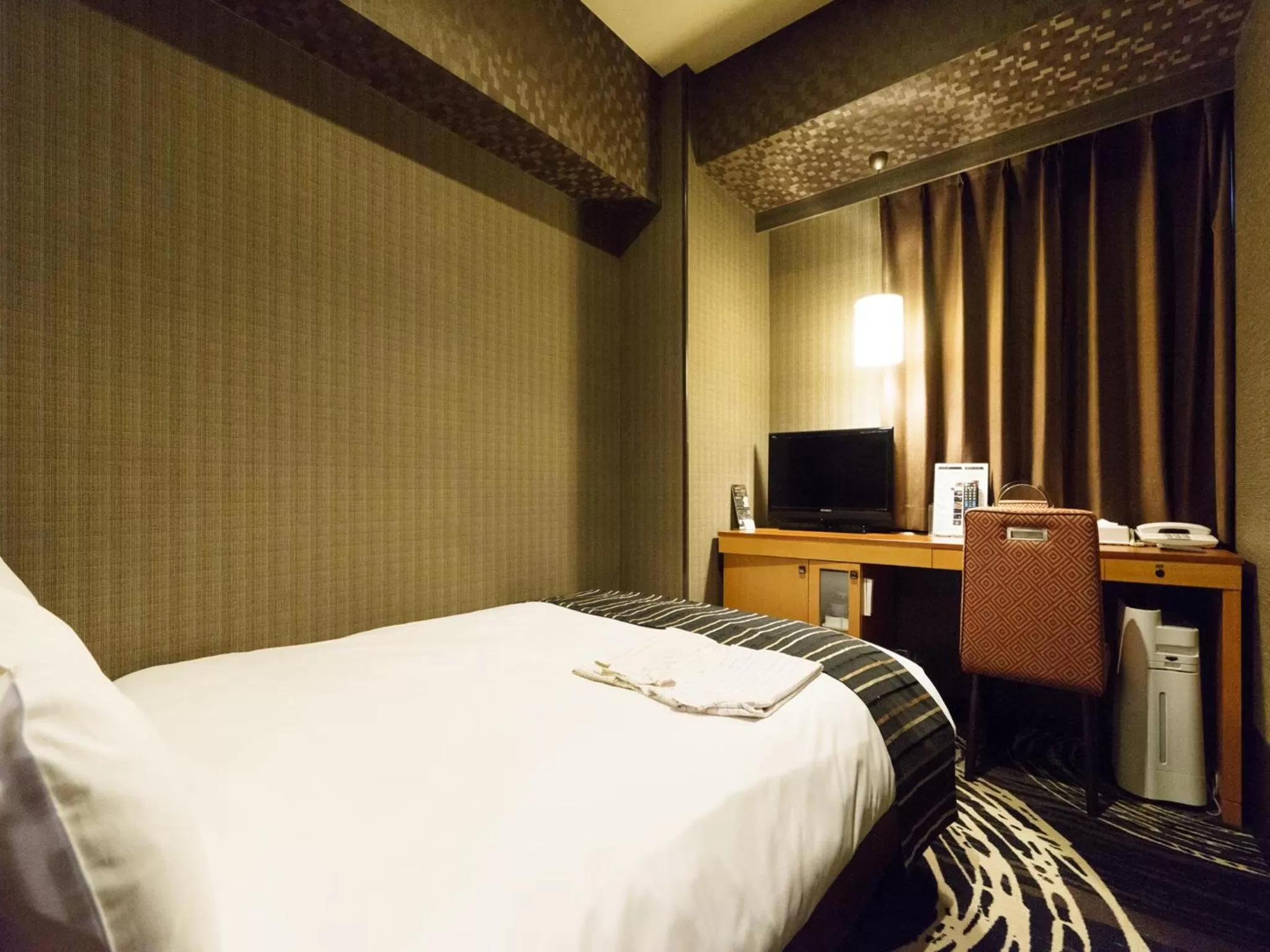 Bed in Sotetsu Fresa Inn Higashi Shinjuku