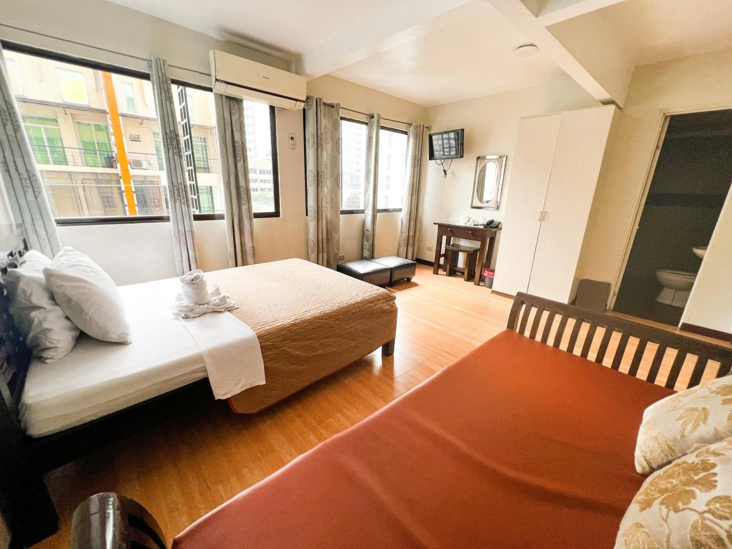 Photo of the whole room, Bed in Stone House Hotel Manila