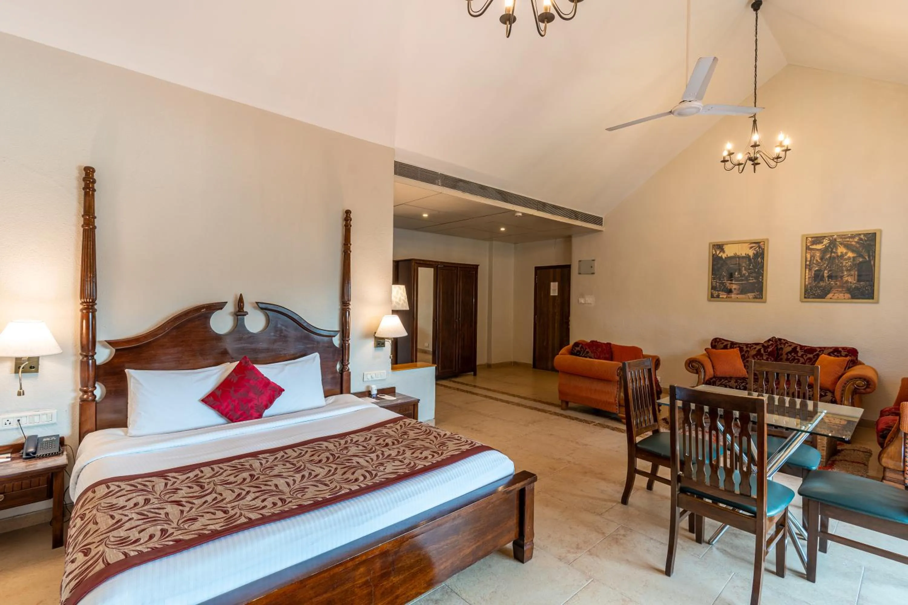 Living room, Bed in Neelam's The Grand Hotel Goa