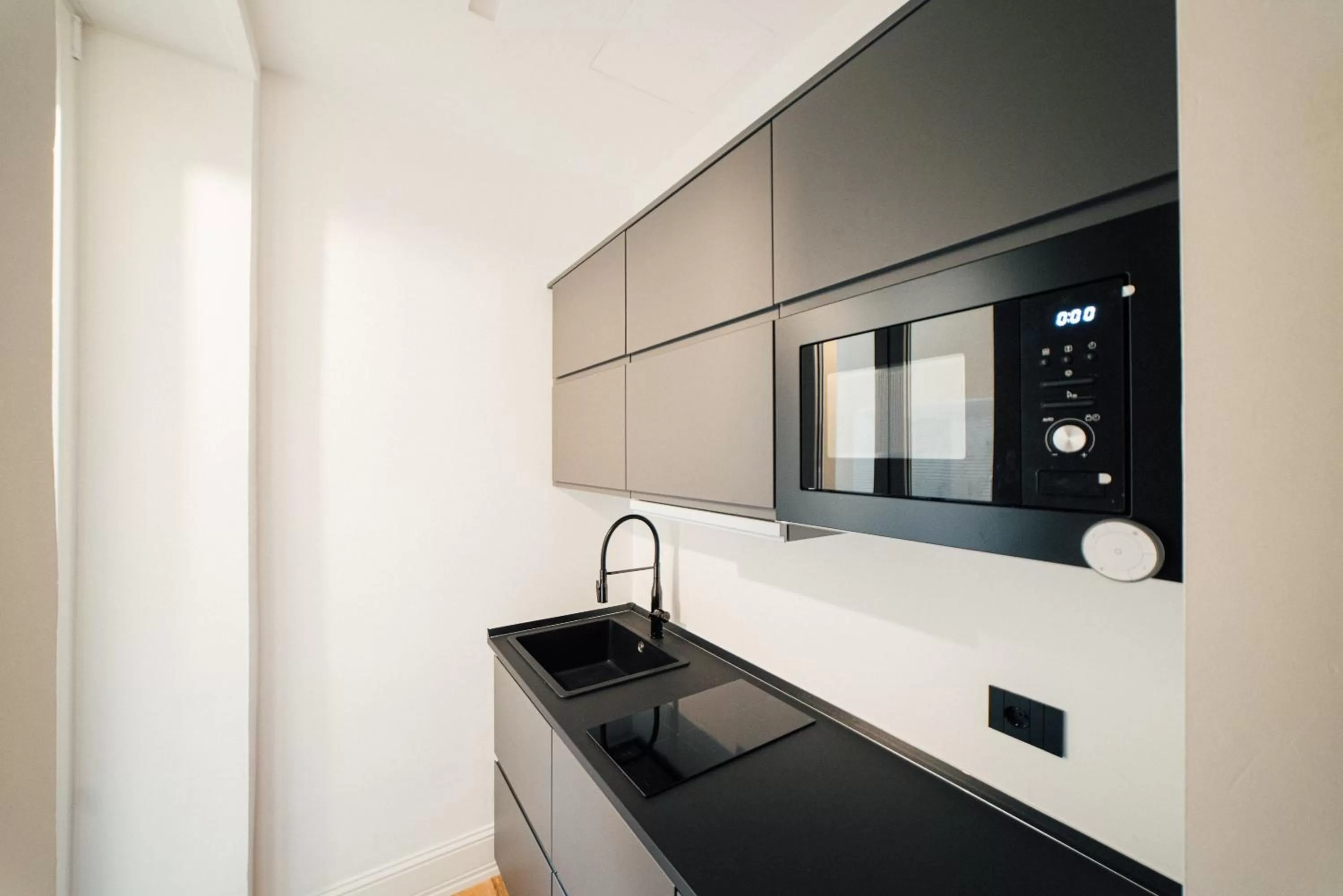 Kitchen or kitchenette in Aron Only Suites Bed and Breakfast