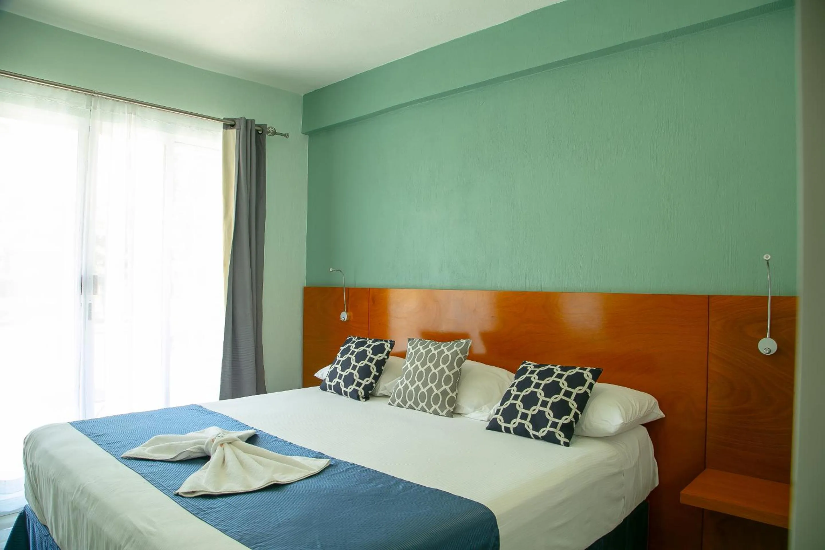 Bed in Relax Inn Suites