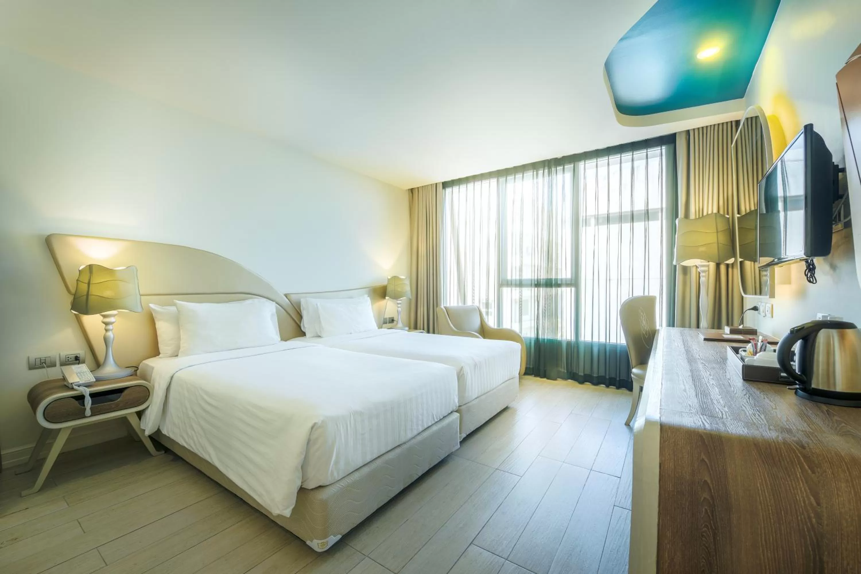 Bed in Le Tada Parkview Hotel