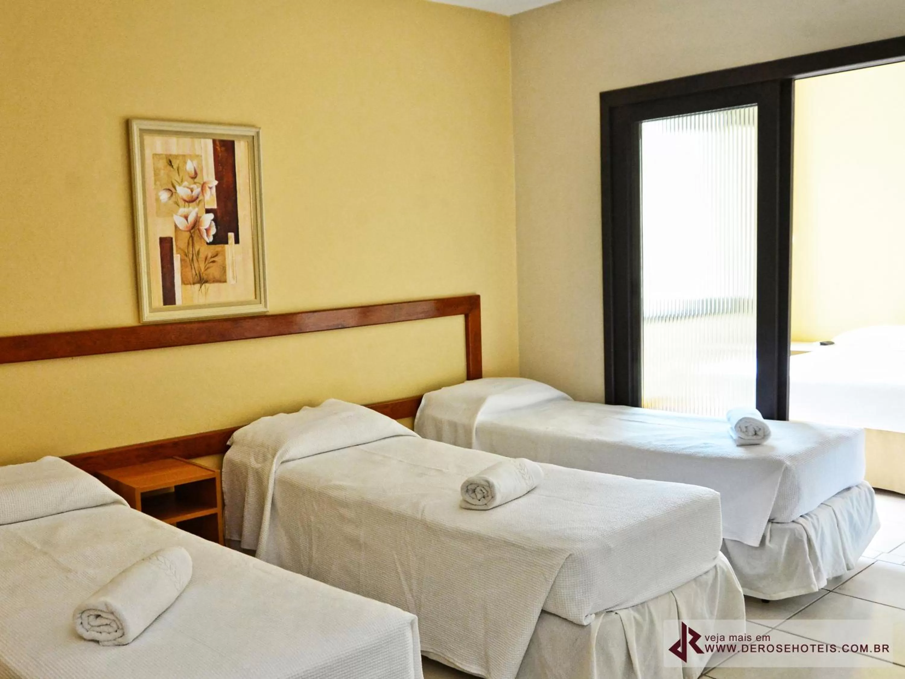 Bed in De Rose Palace Hotel