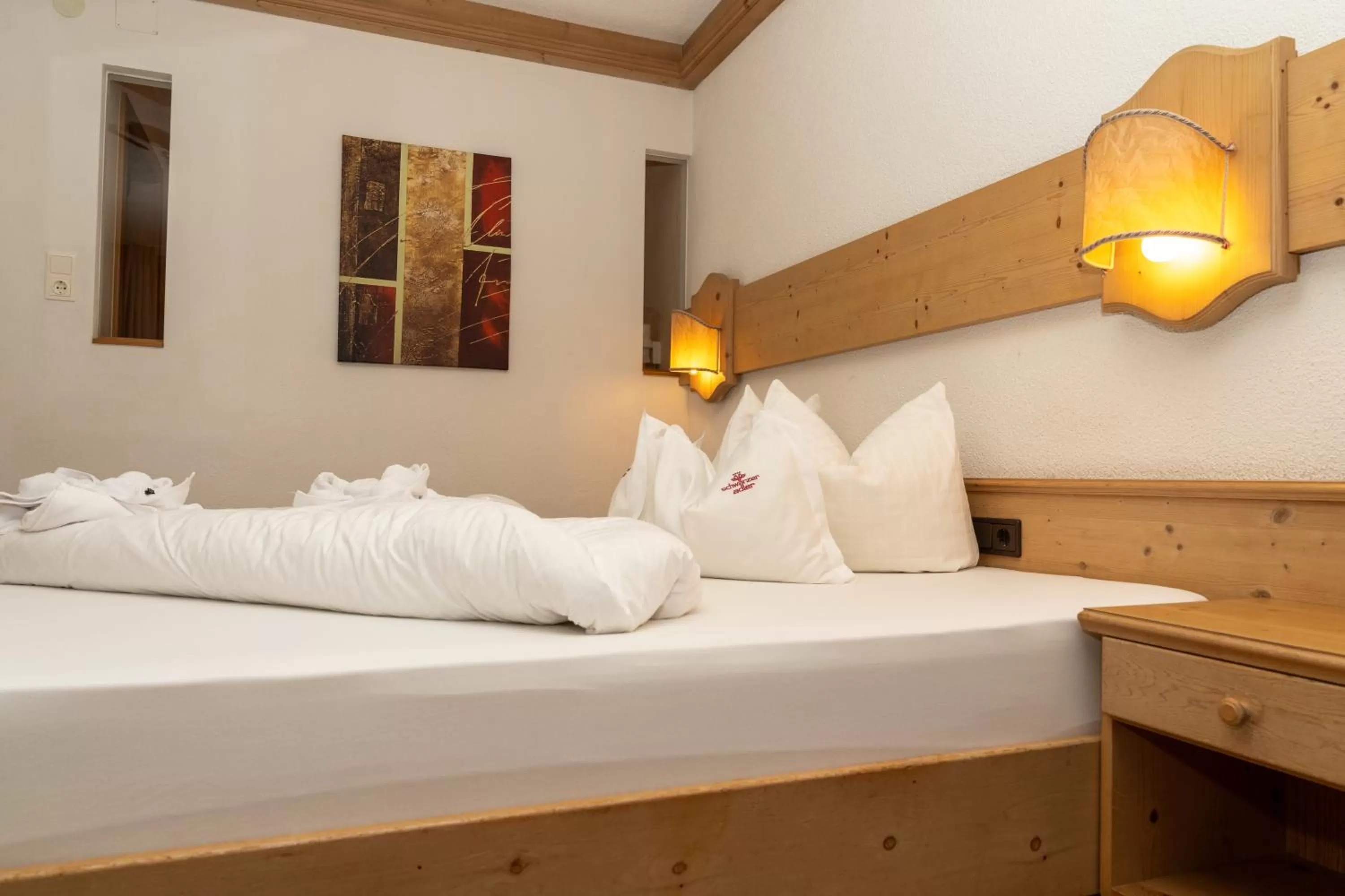 Bed in Hotel Schwarzer Adler