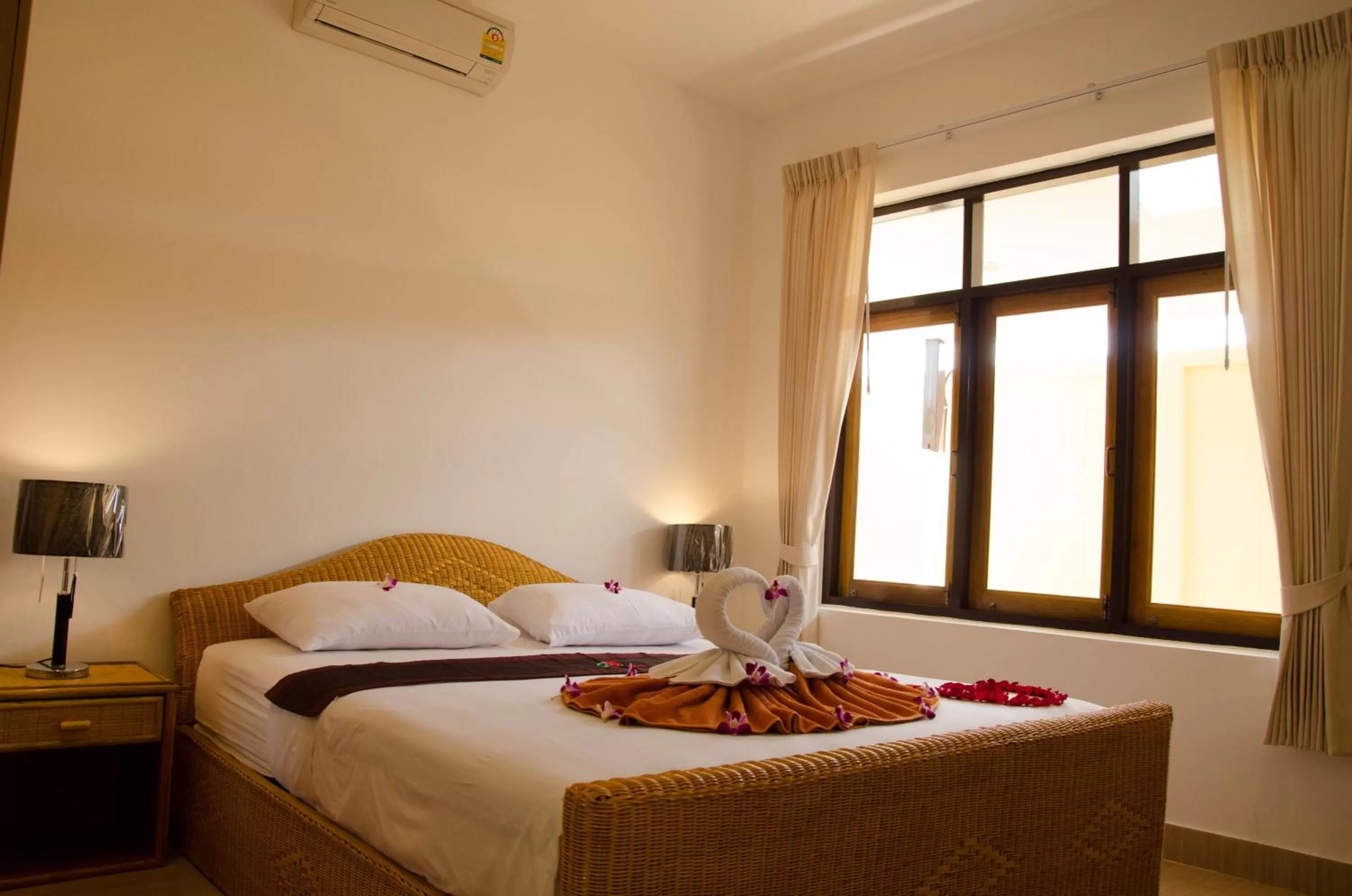 Bed in Jungle Village Bungalow