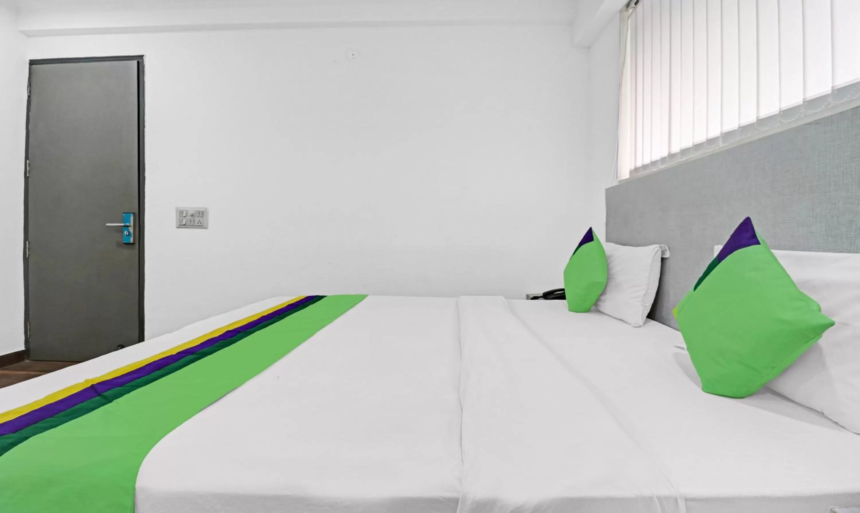 Bedroom, Bed in Treebo Grand Town House