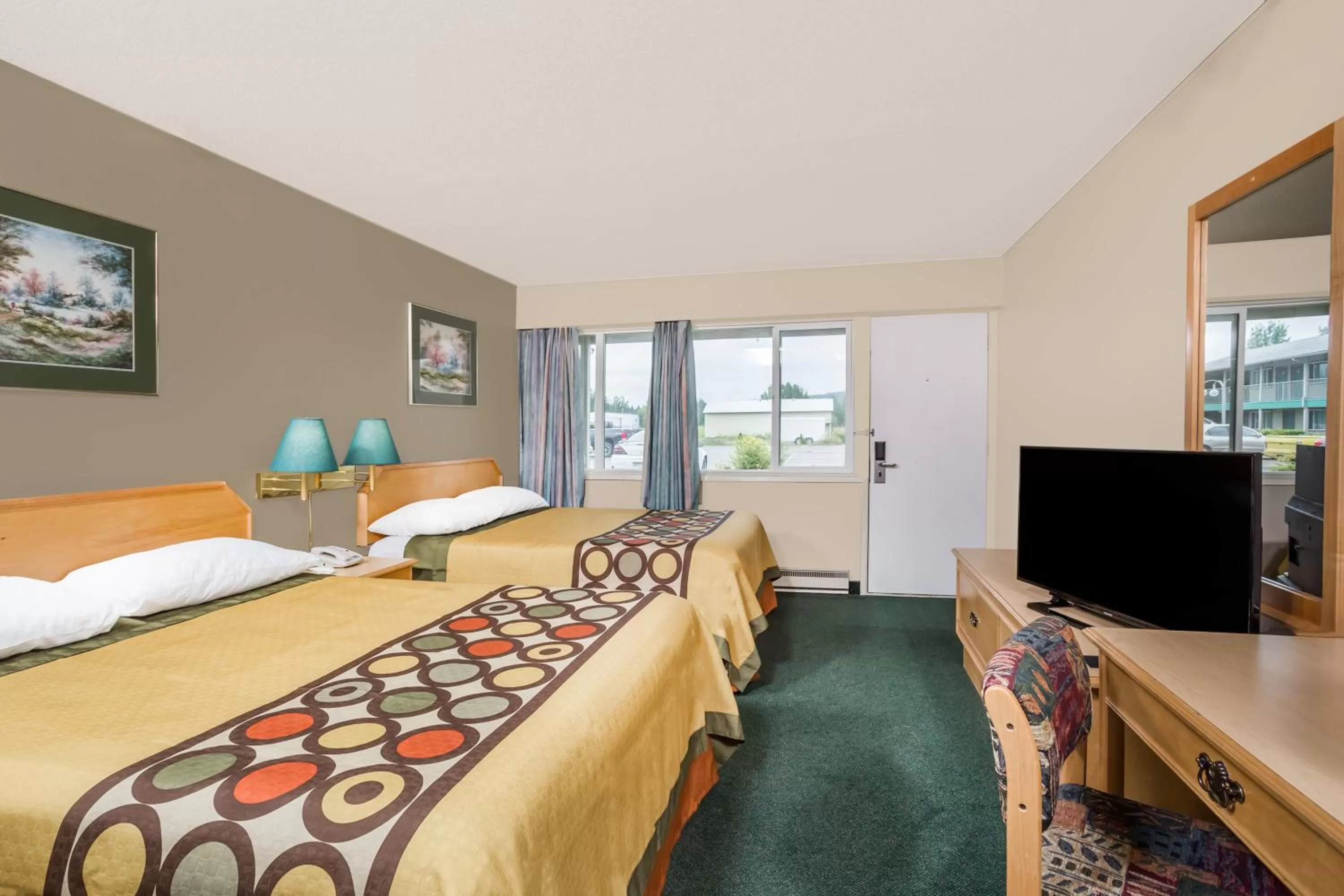 Communal lounge/ TV room, Bed in Super 8 by Wyndham Quesnel BC