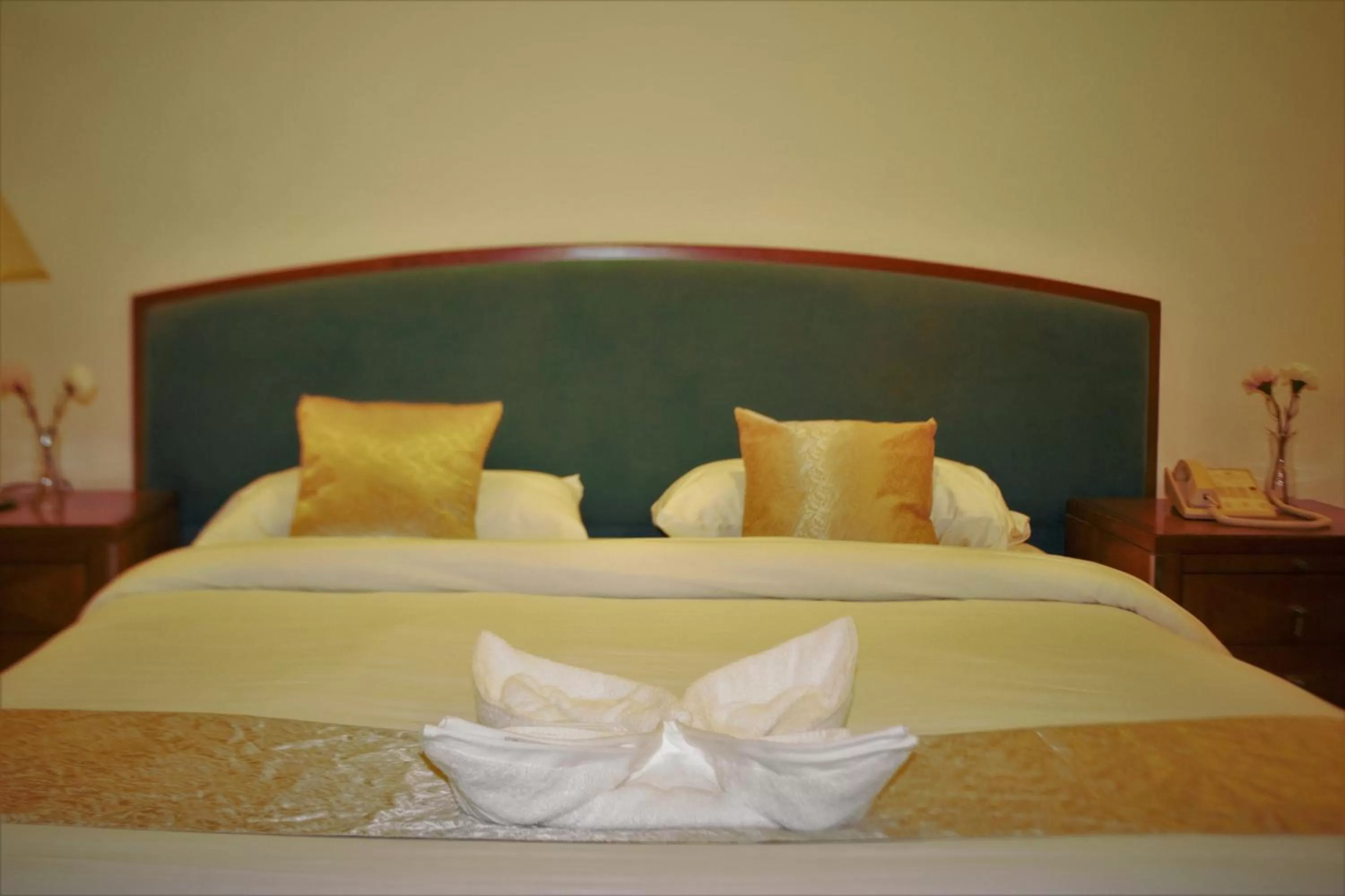 Bed in New MerryLand Hotel