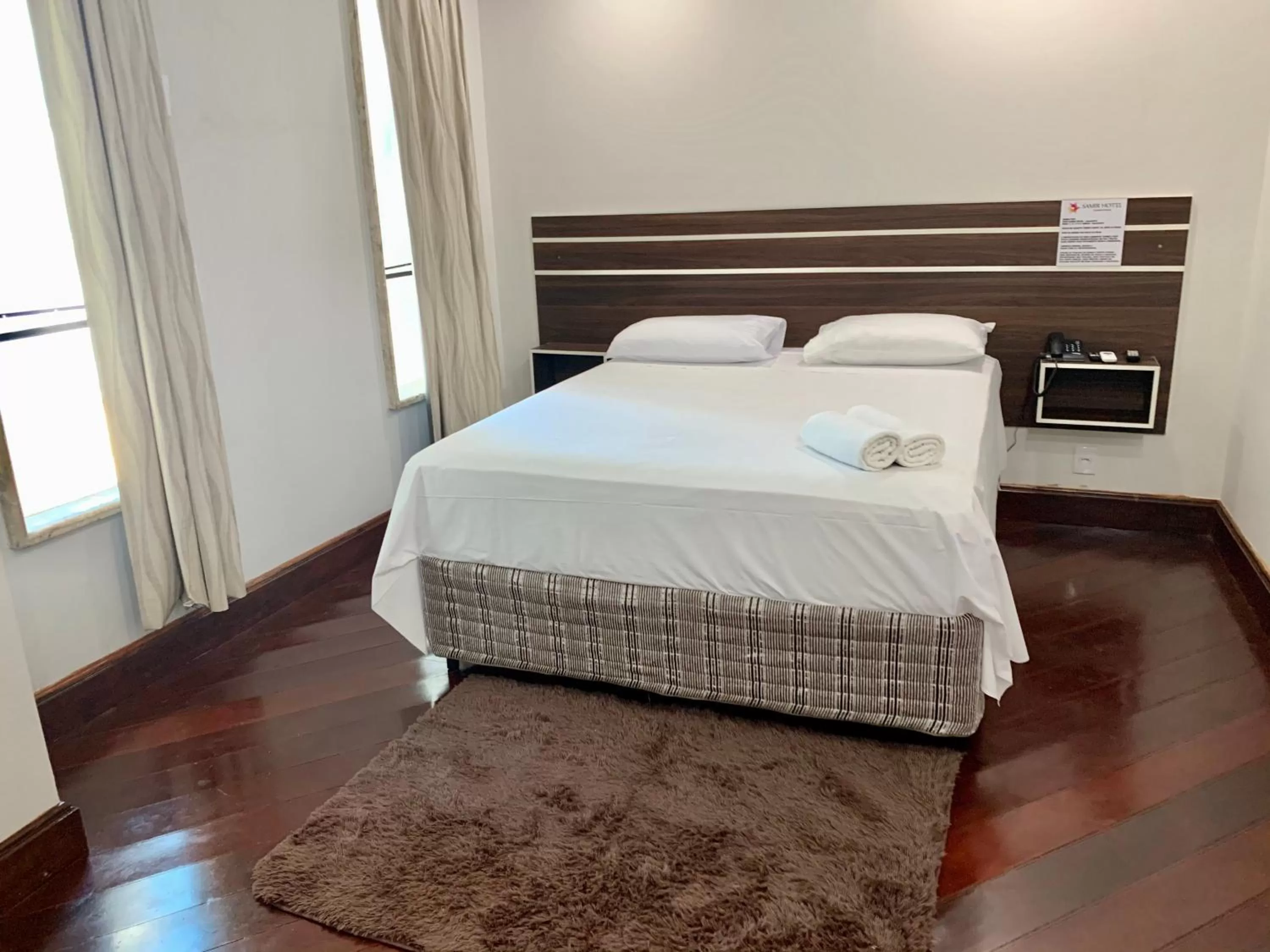 Bed in SAMIR HOTEL COMFORT