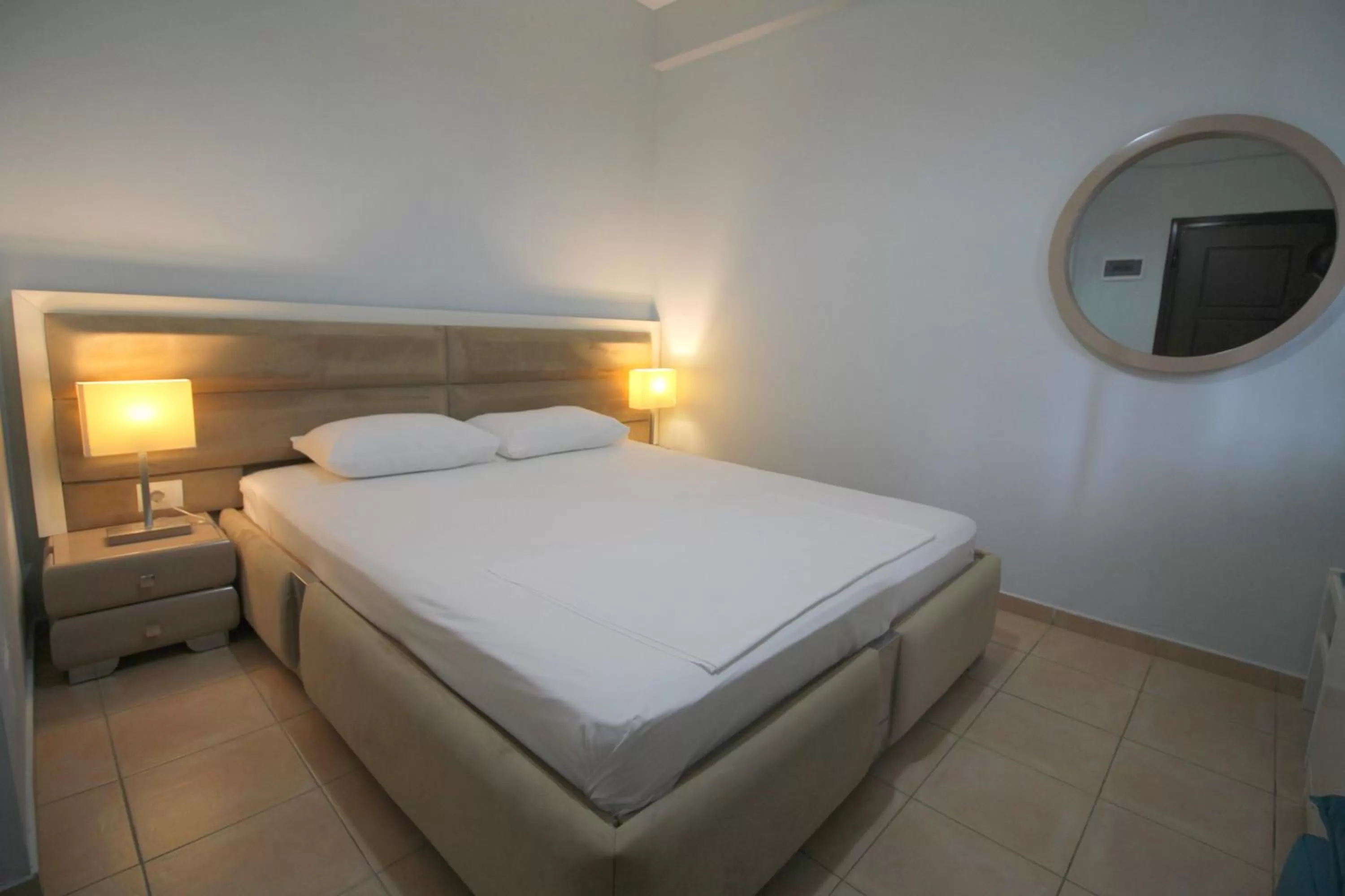 Bed in Murati Suites Sarandë