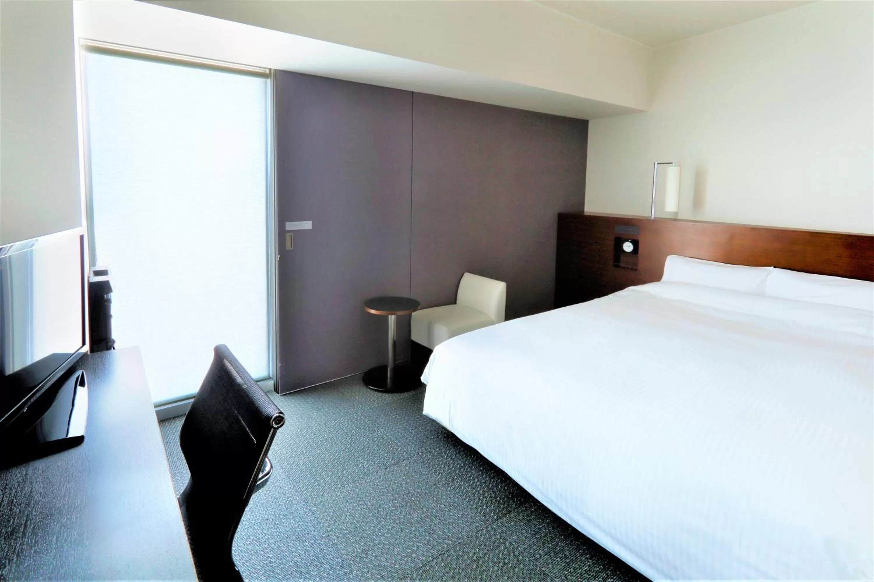Photo of the whole room, Bed in JR Inn Sapporo