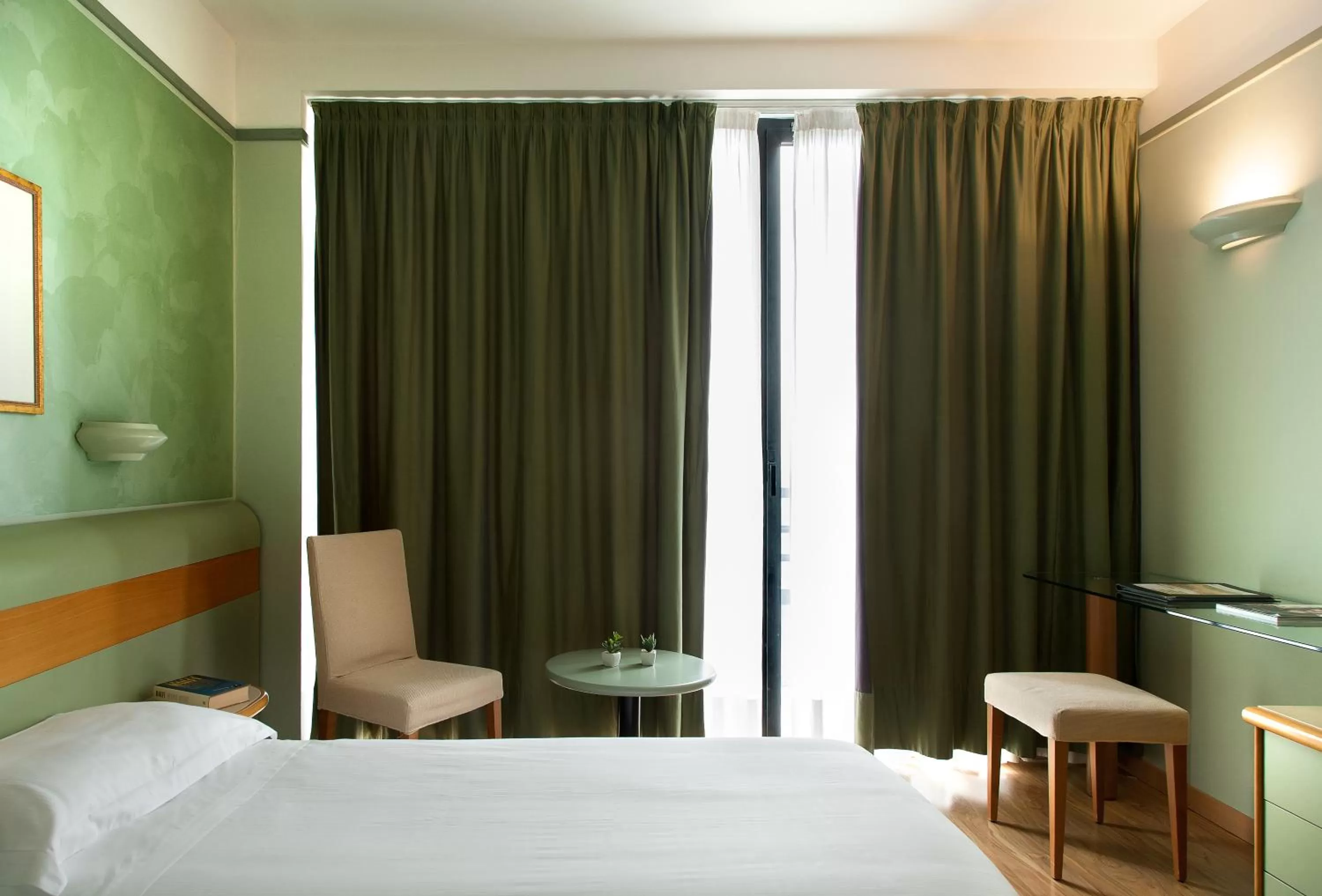 Bed in Hotel Leonardo da Vinci