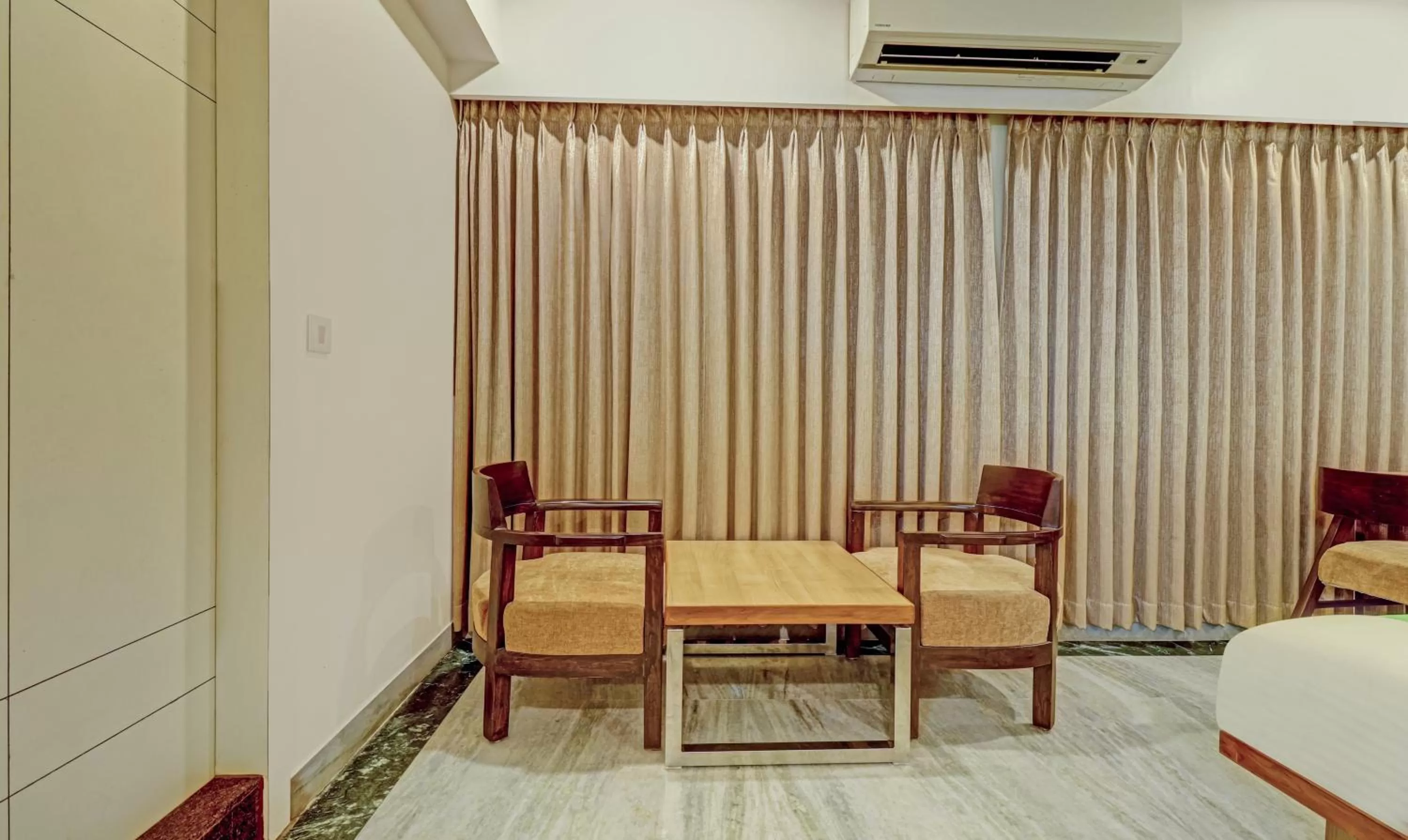 Seating area, Bed in Treebo Seaesta RK Beach