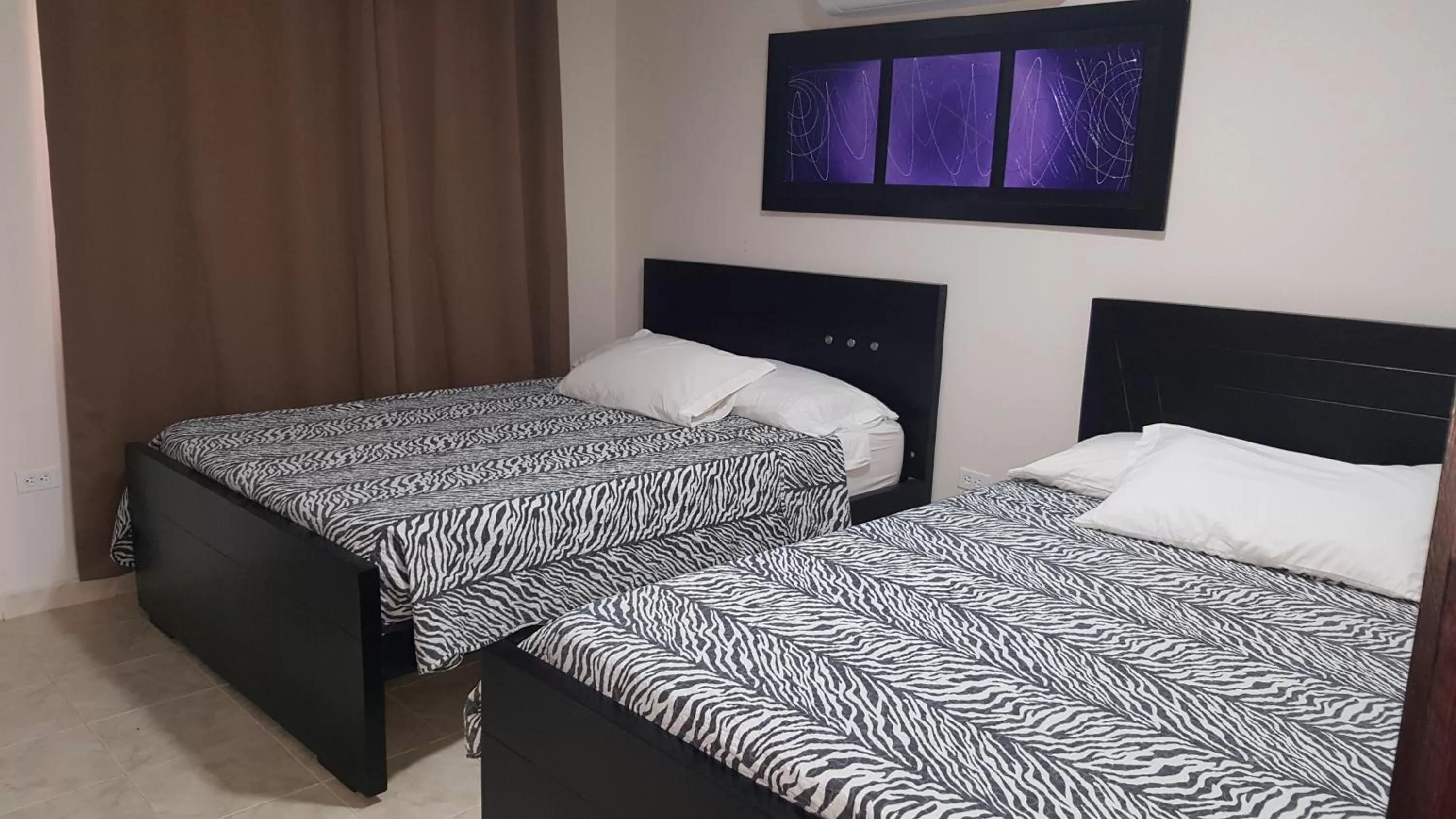 Bed in Caribbean Island Hotel Piso 2