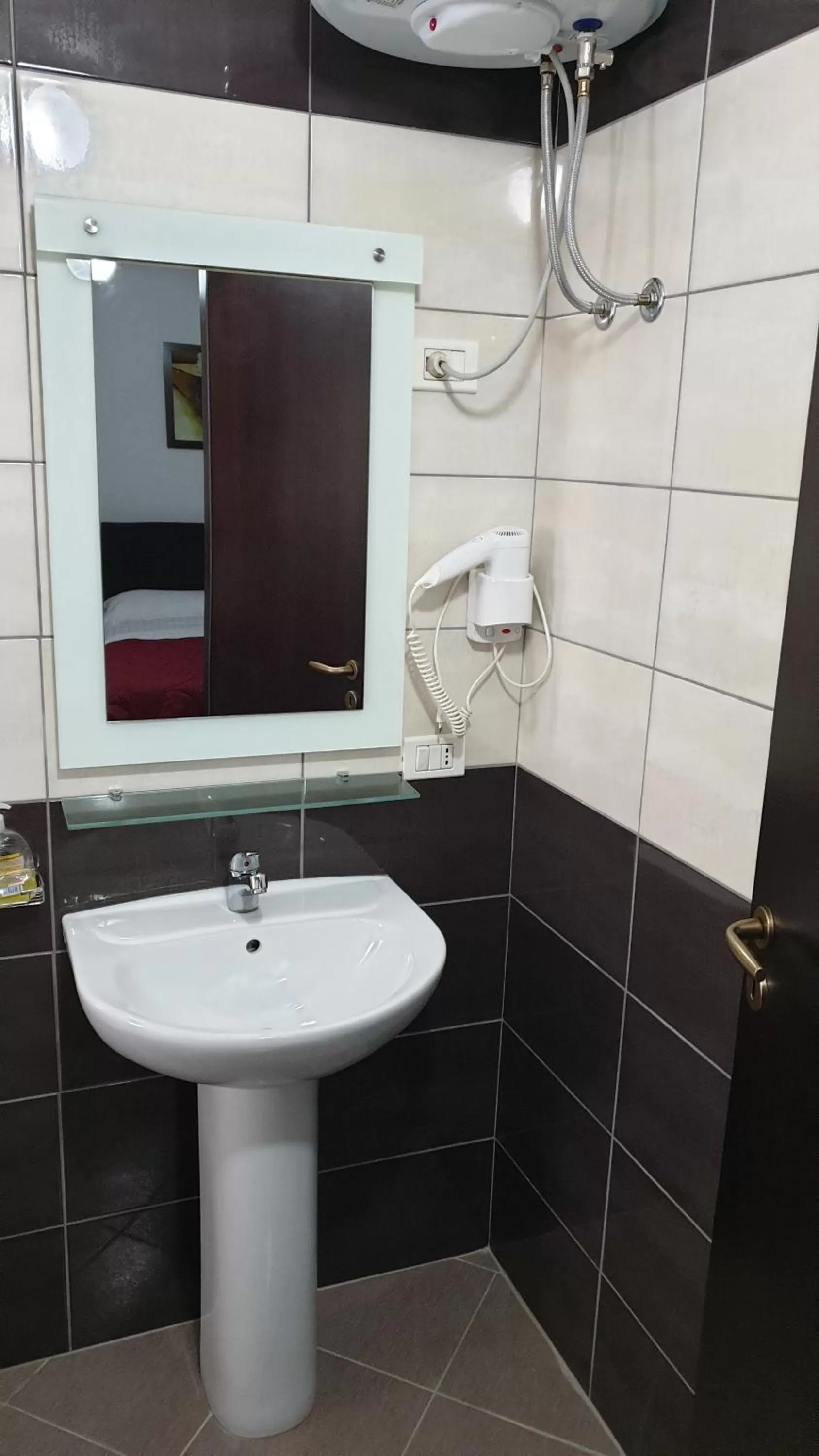 Bathroom in Haris Hotel