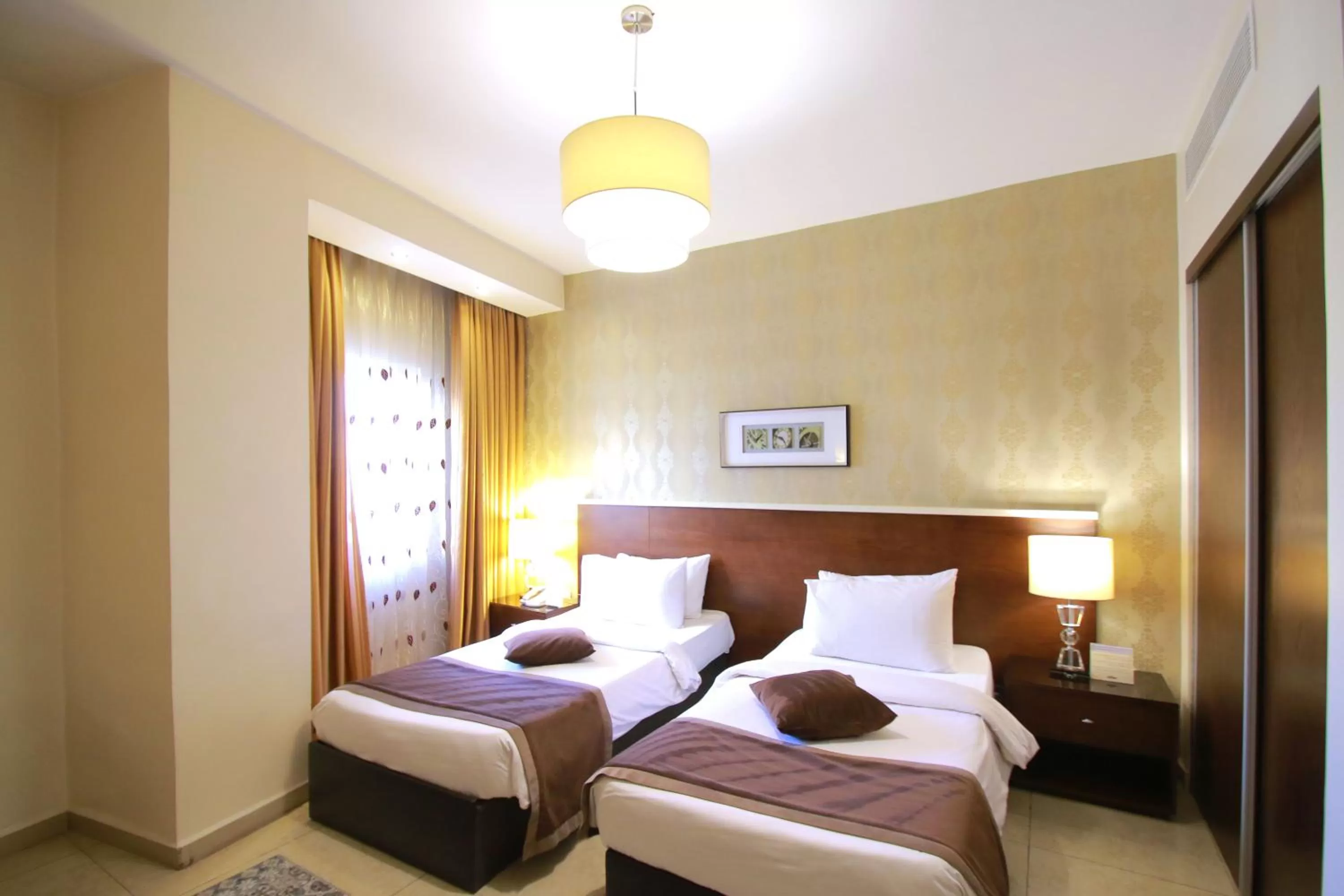 Bed in City Rose Hotel Suites