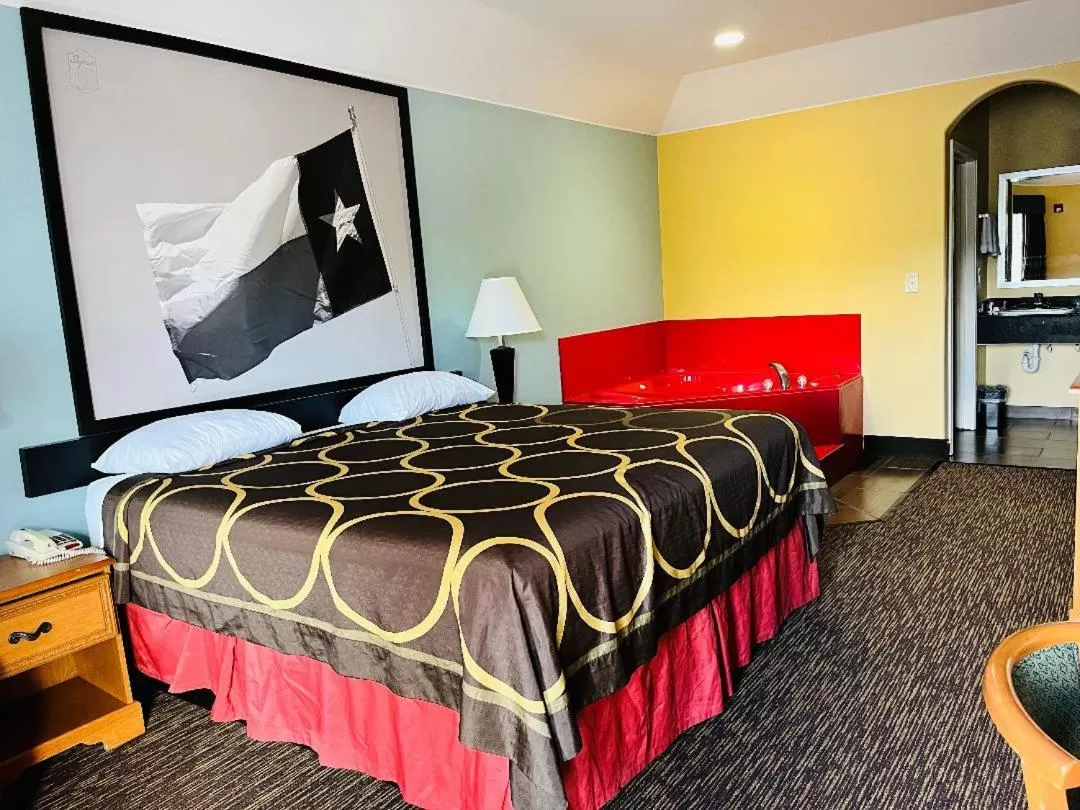 Bed in Super 8 by Wyndham Montgomery/ Lake Conroe