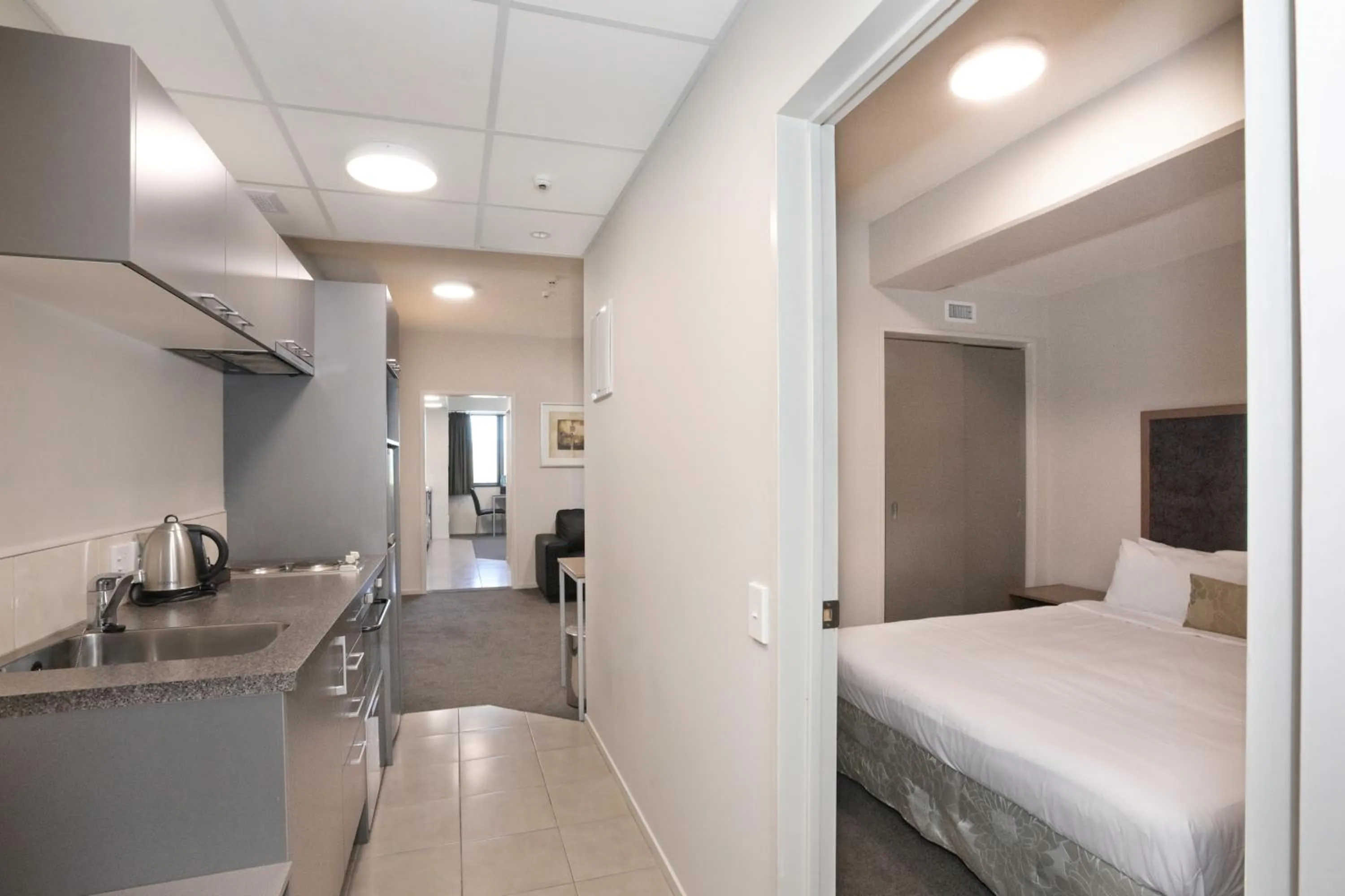 Kitchen or kitchenette, Bed in Quality Suites Central Square