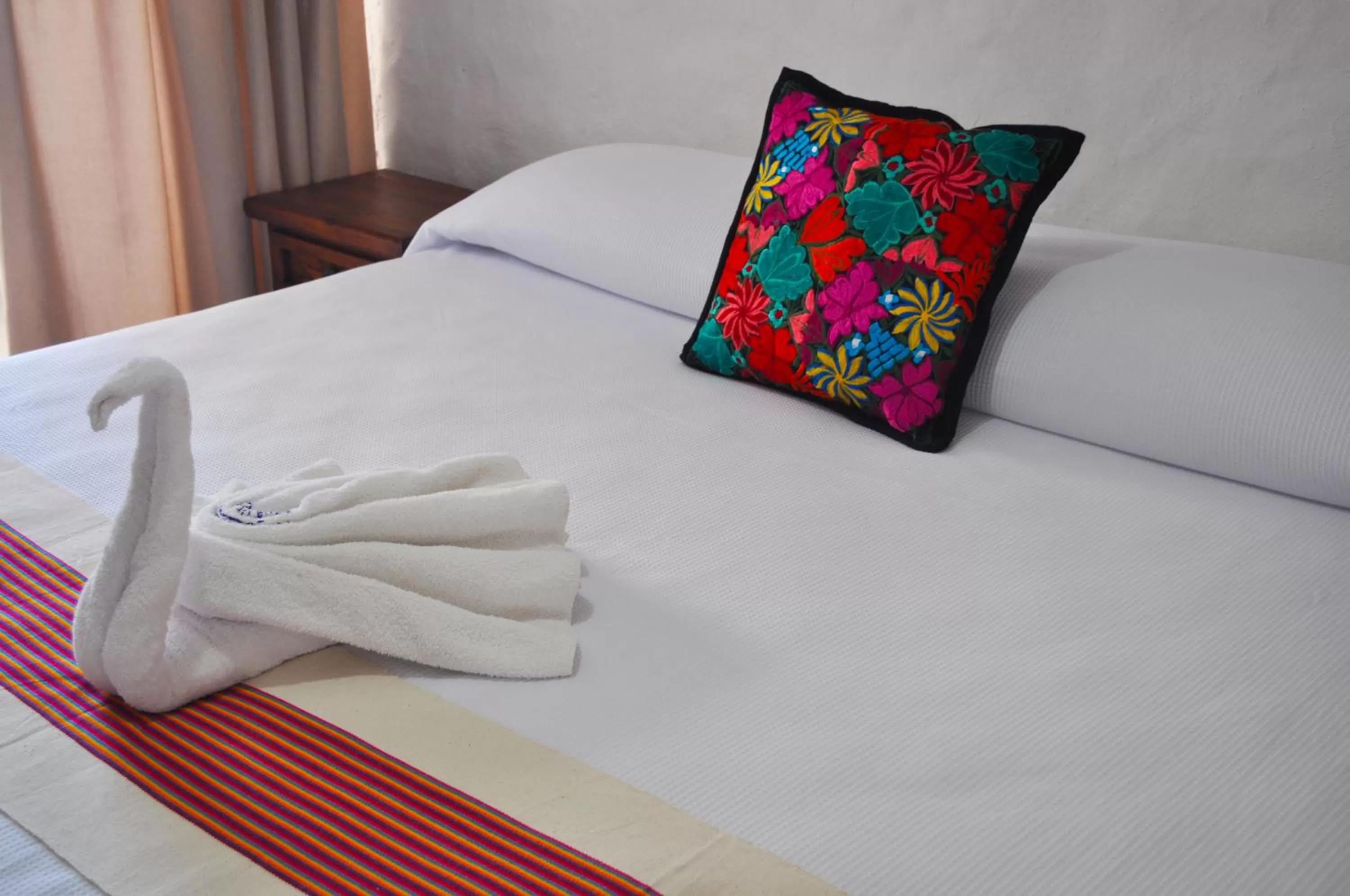 Bed in Petit Hotel Pilitas