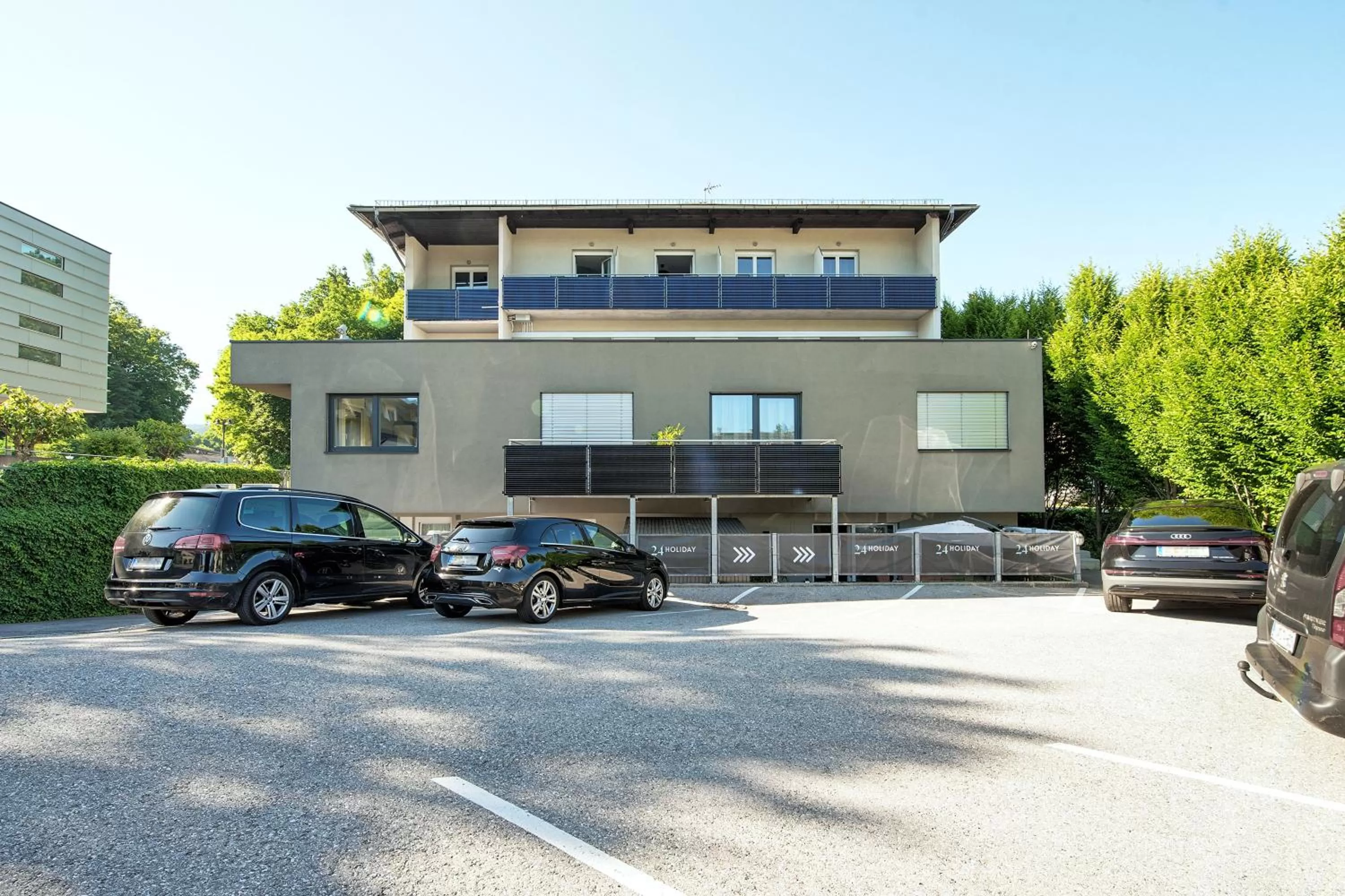 Parking, Property Building in Hotel 24 Checkin Velden