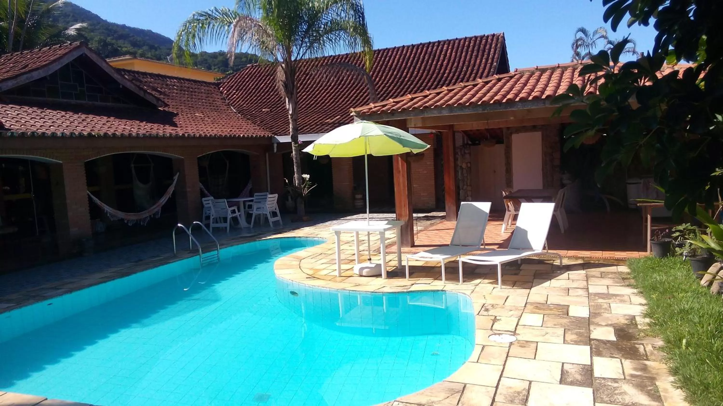 Swimming pool in Pousada Na Praia Ubatuba