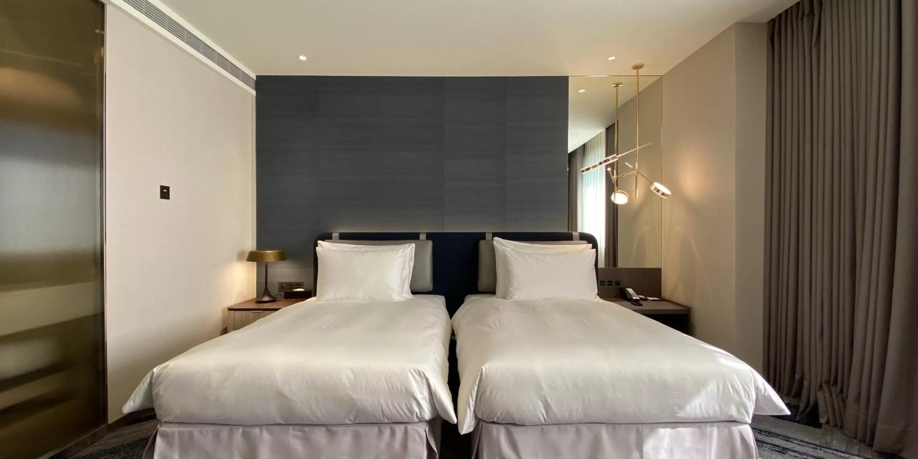 Bed in Monarch Plaza Hotel