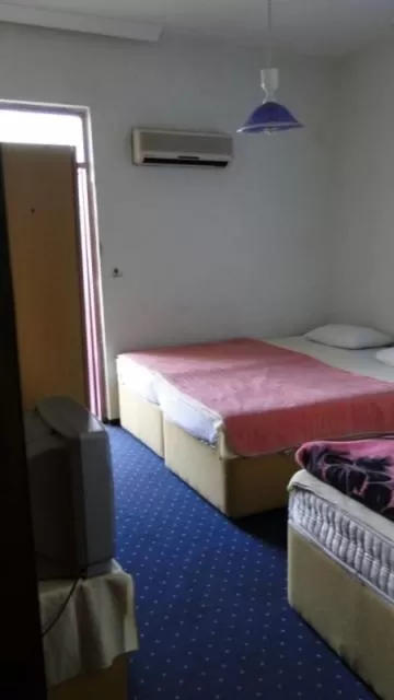 Bed in Sunrise Hotel