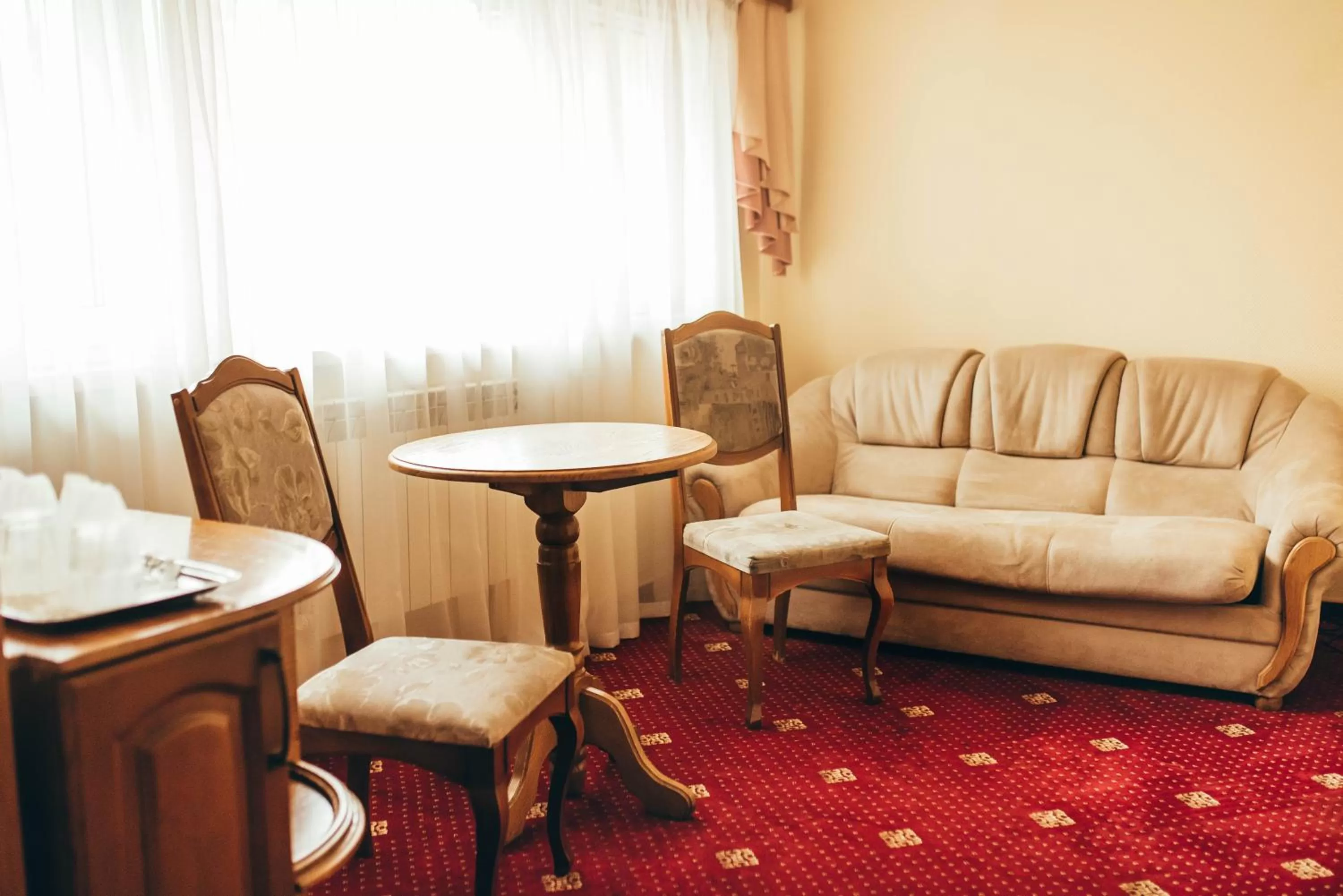 Bed, Seating Area in Lyube