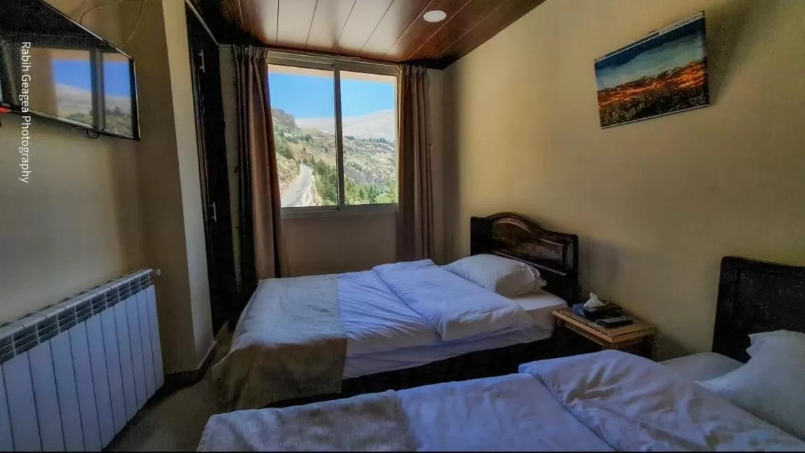 Bed in Hotel L'Aiglon