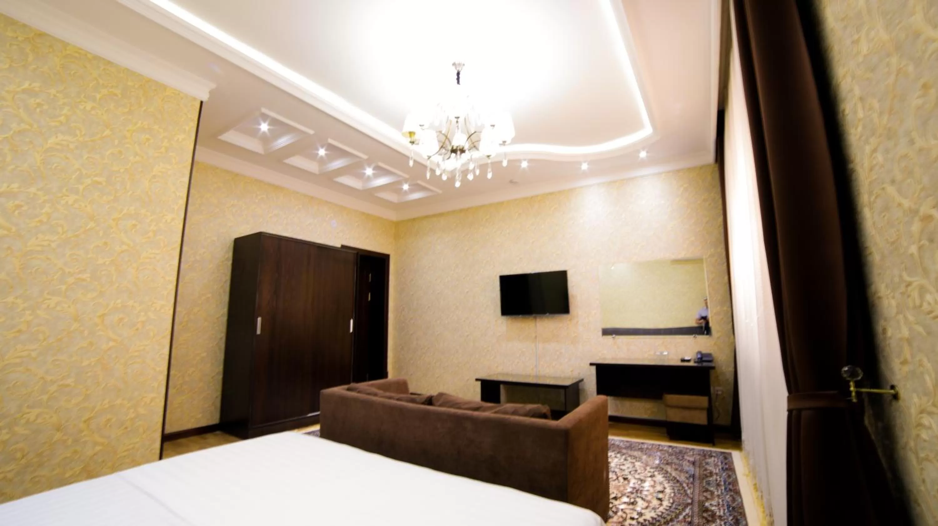 Photo of the whole room, TV/Entertainment Center in Alliance Hotel Tashkent
