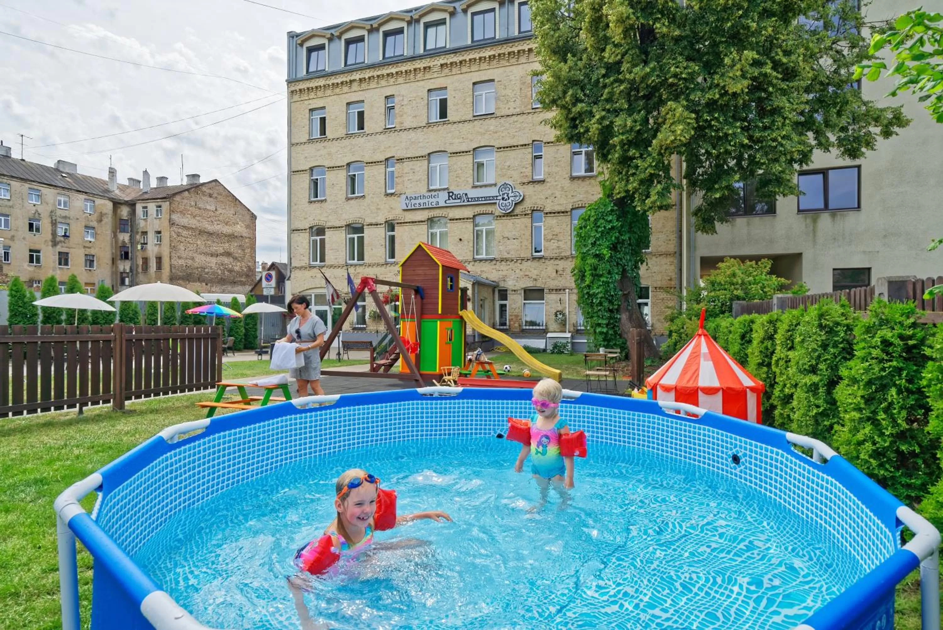 Children play ground in RIGAAPARTMENT SONADA Self-Service Aparthotel - Private Parking