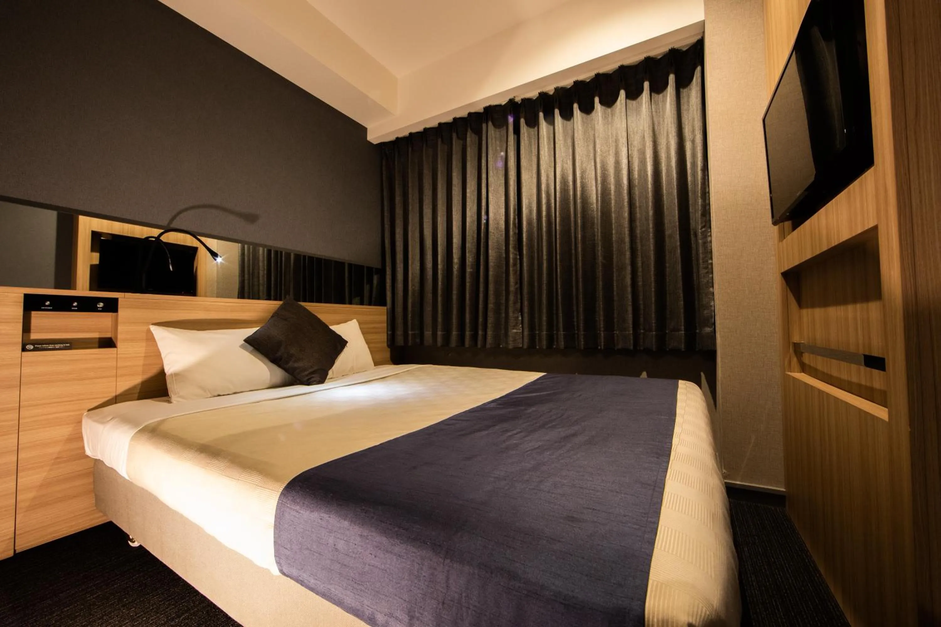 Photo of the whole room, Bed in Quintessa Hotel Osaka Shinsaibashi Comic & Books