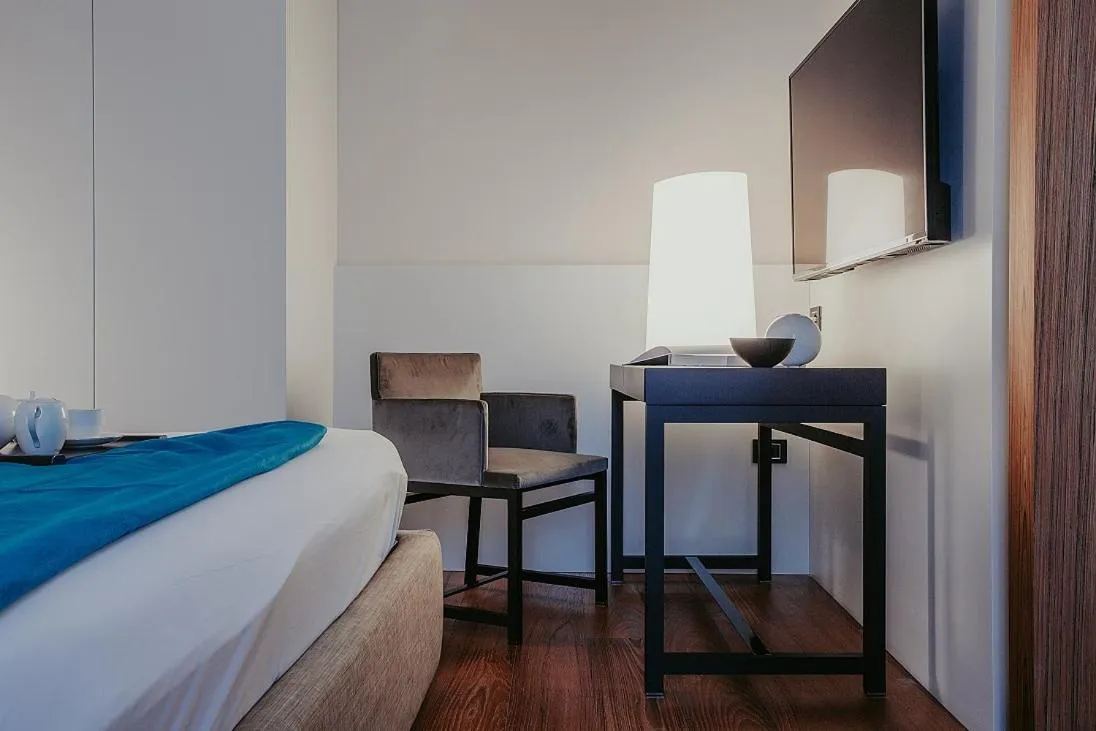 Bed in Bacã Suites, Restaurant & Bar