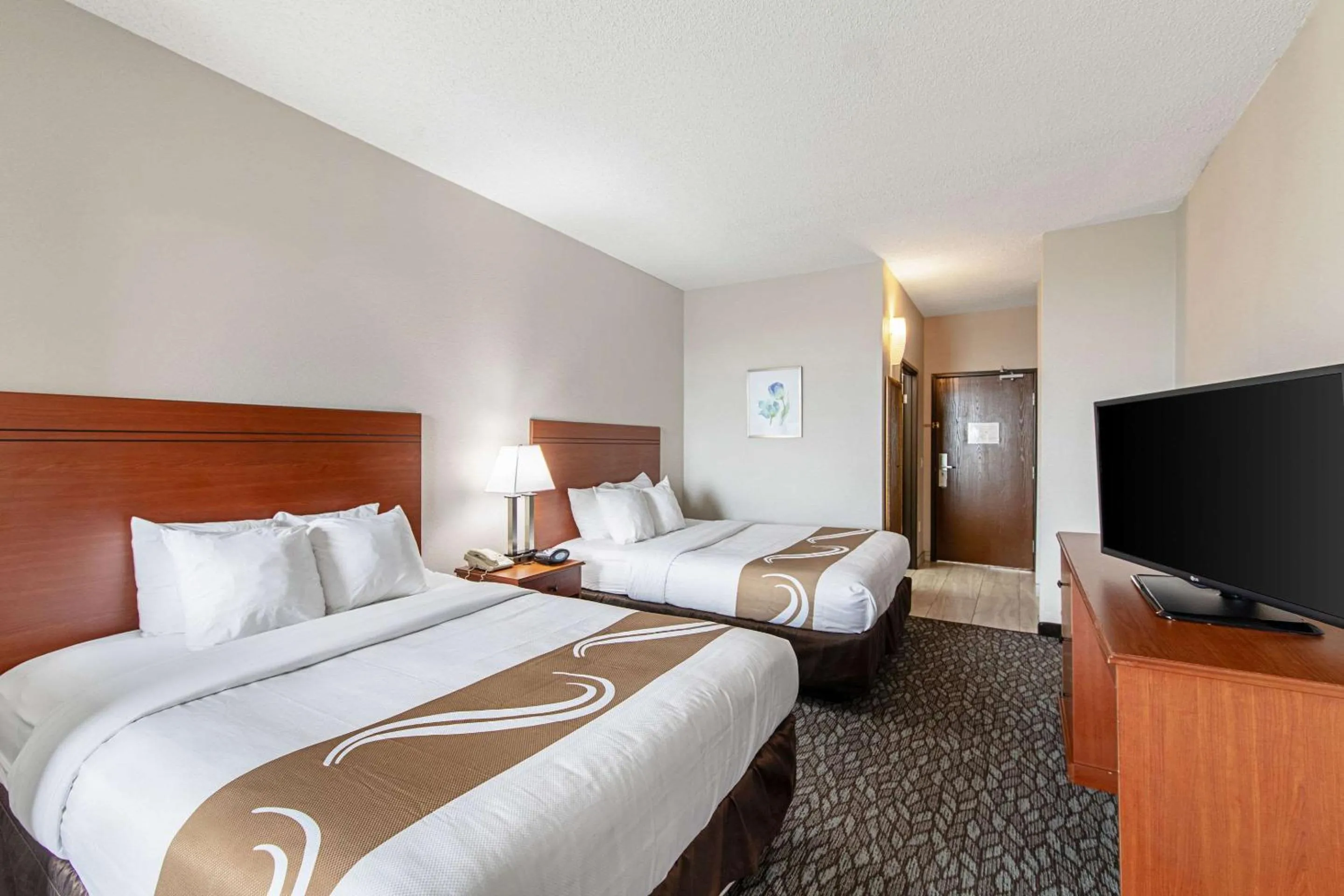 Bedroom, Bed in Quality Suites Austin South Street Elmo District