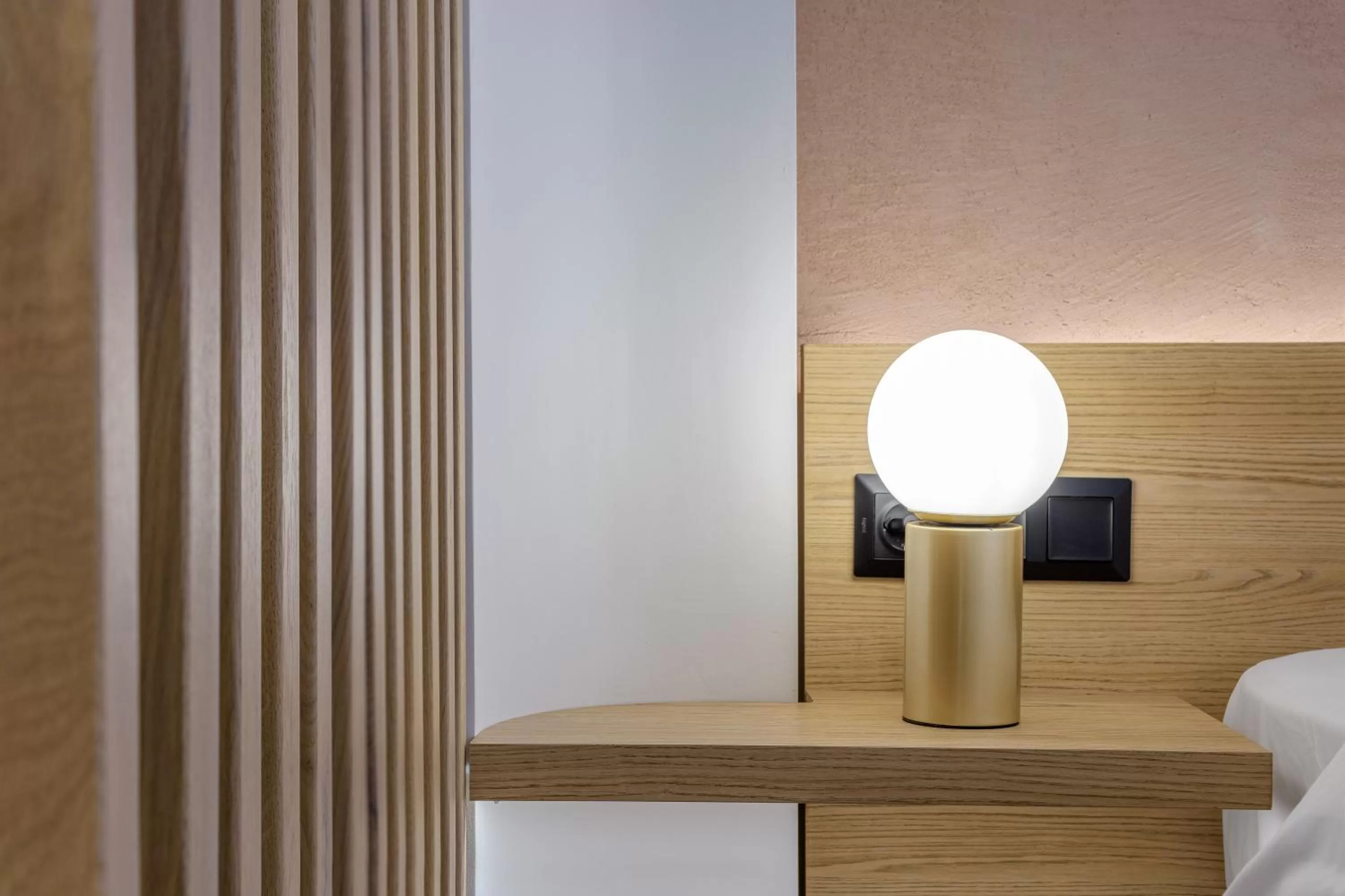 Bed in Acropolis Magenta Luxury Suites