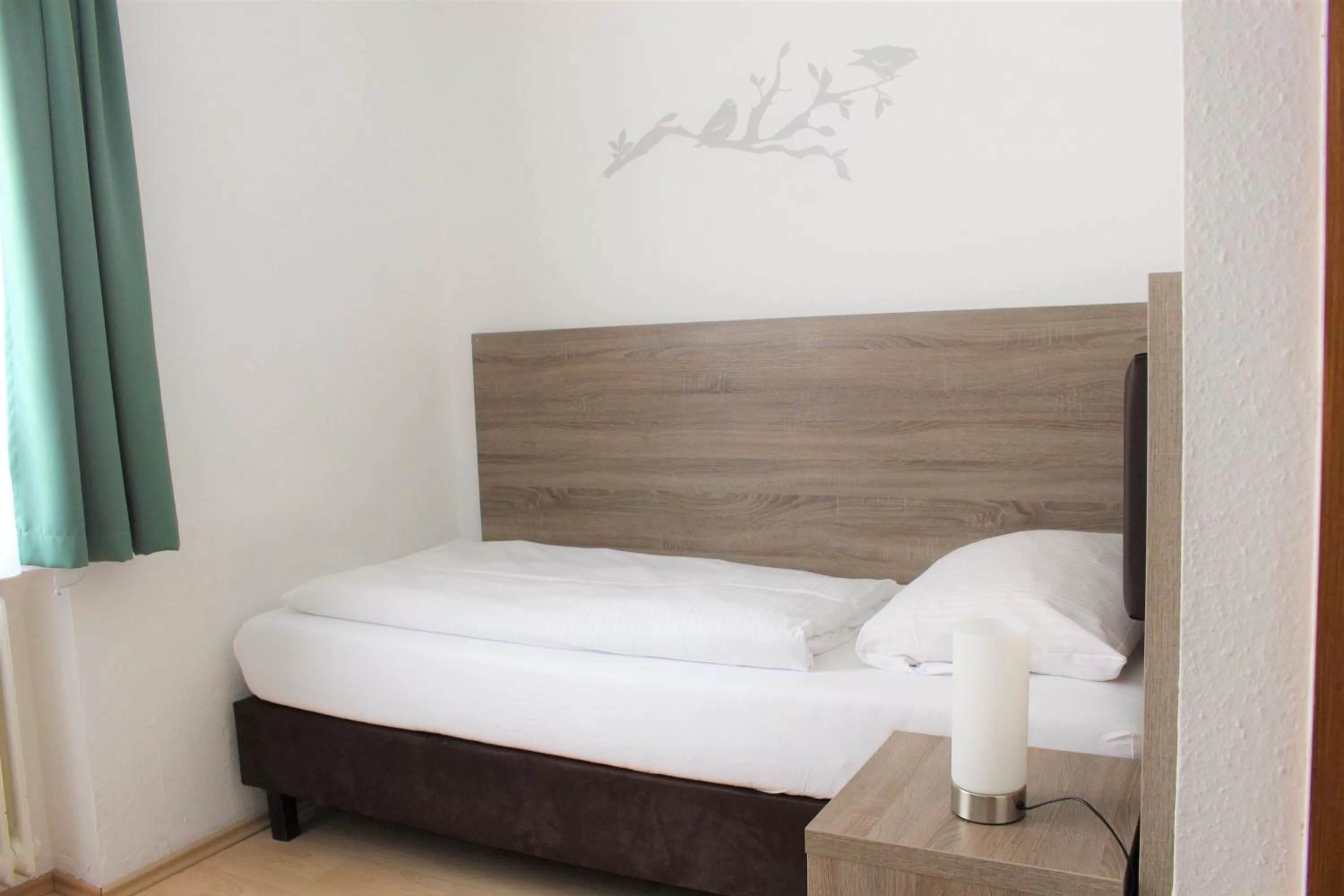 Bed in Hotel Ulmer Spatz