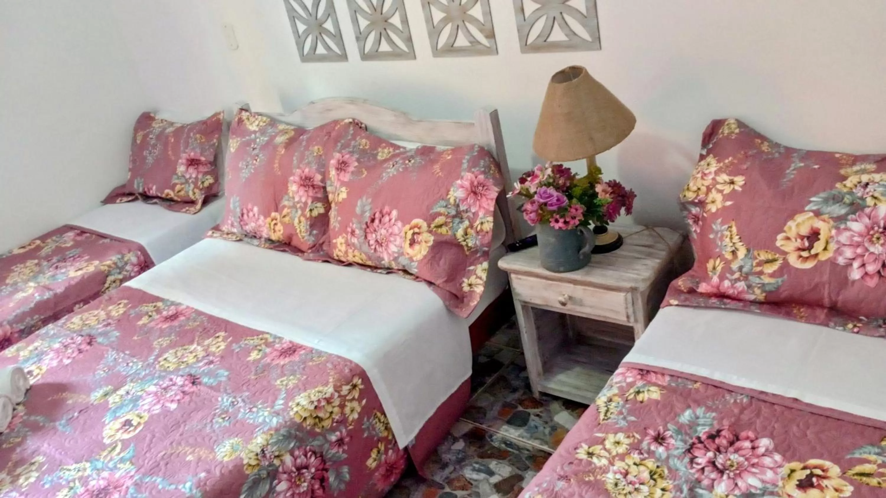 Bed in Hibiscos Pousada