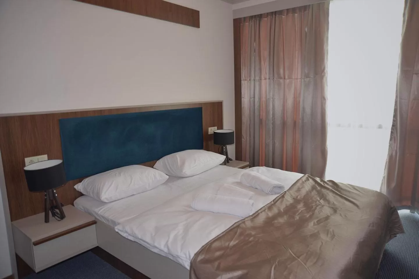 Bed in TEVETOGLU HOTEL